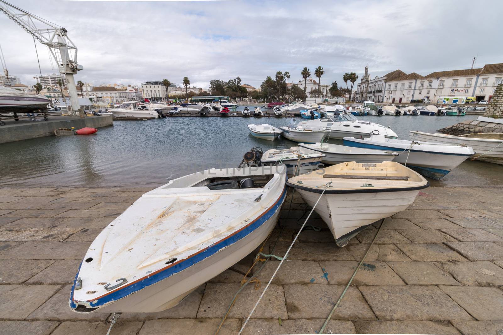 Wide view of Faro city docks with fishing and recreational boats.