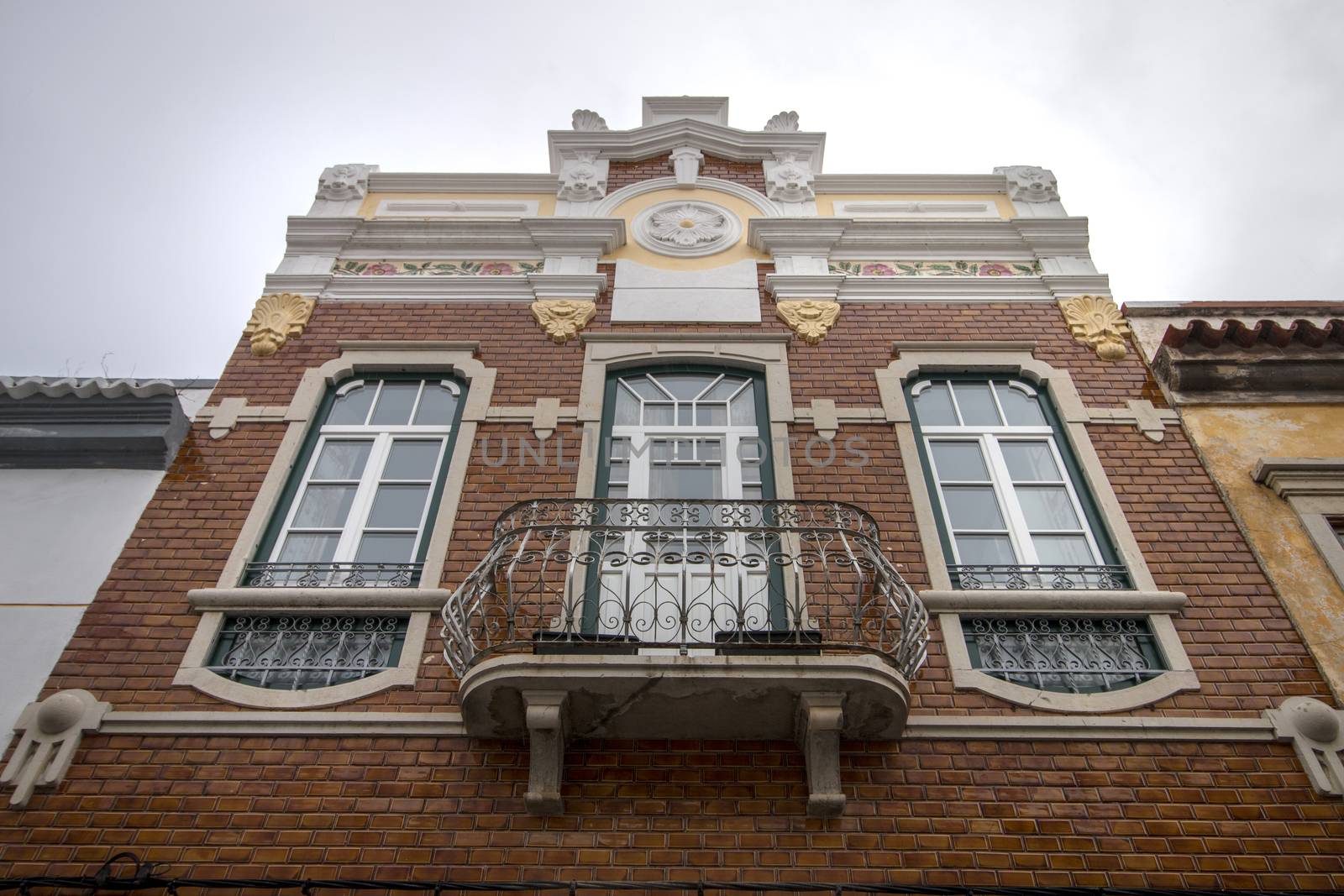 portuguese building with orange azulejo tiles, typical of European mediterranean countries.