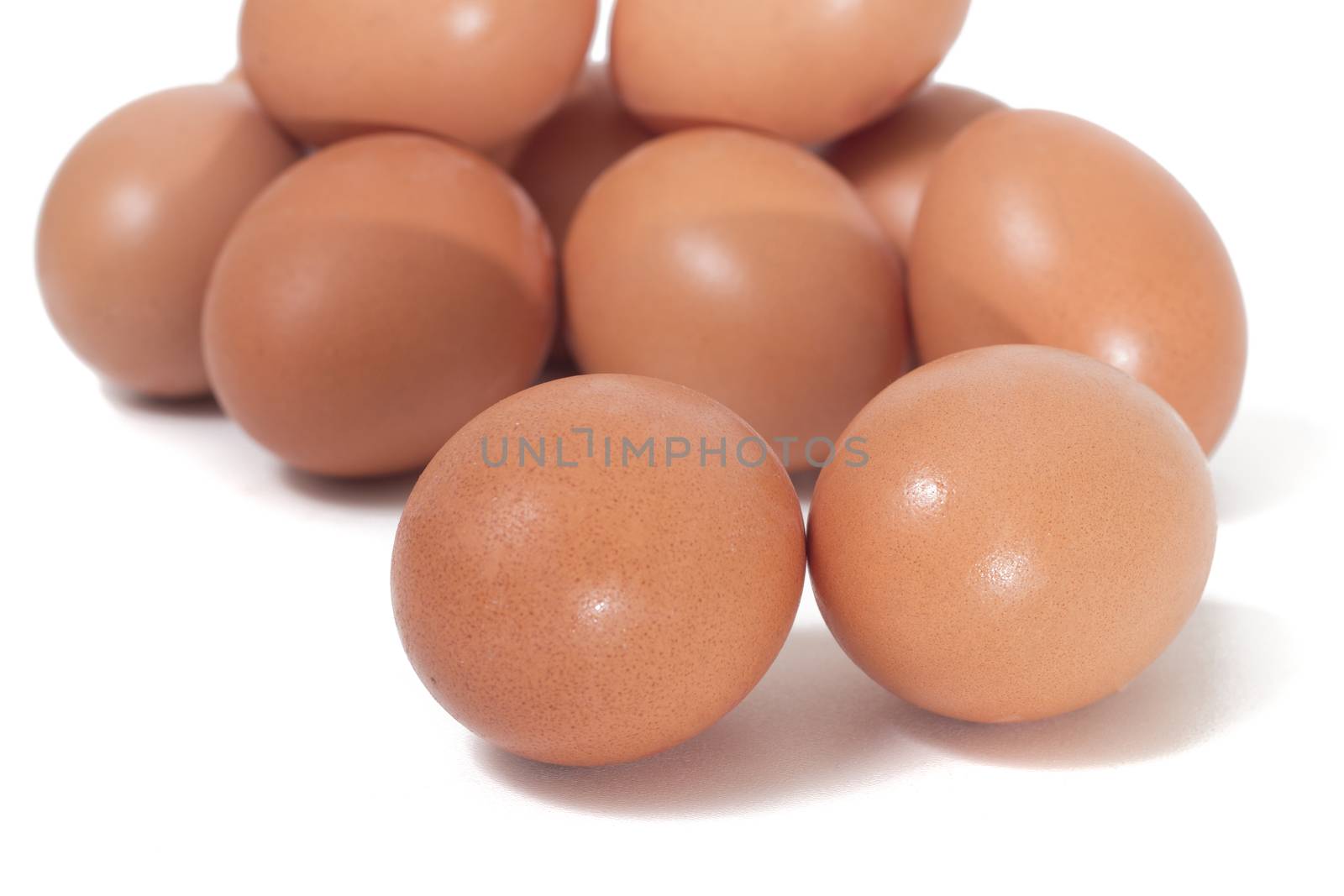 pile of chicken eggs isolated on a white background.