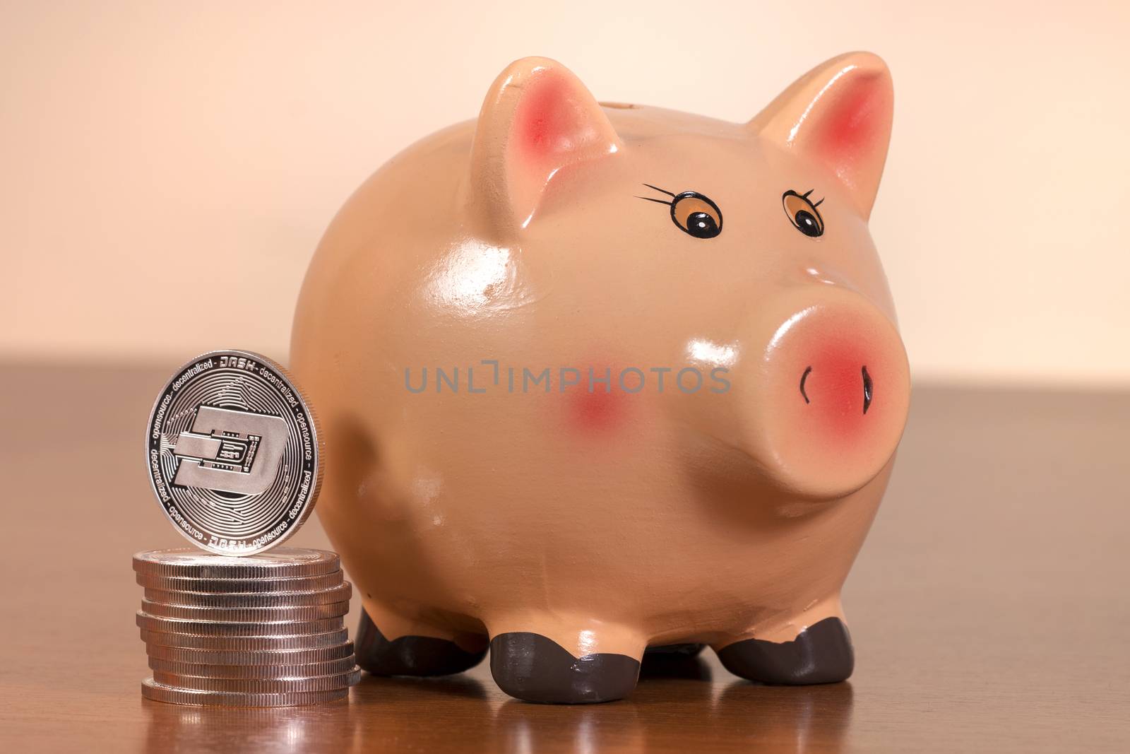 Piggy bank with several dash coins by membio