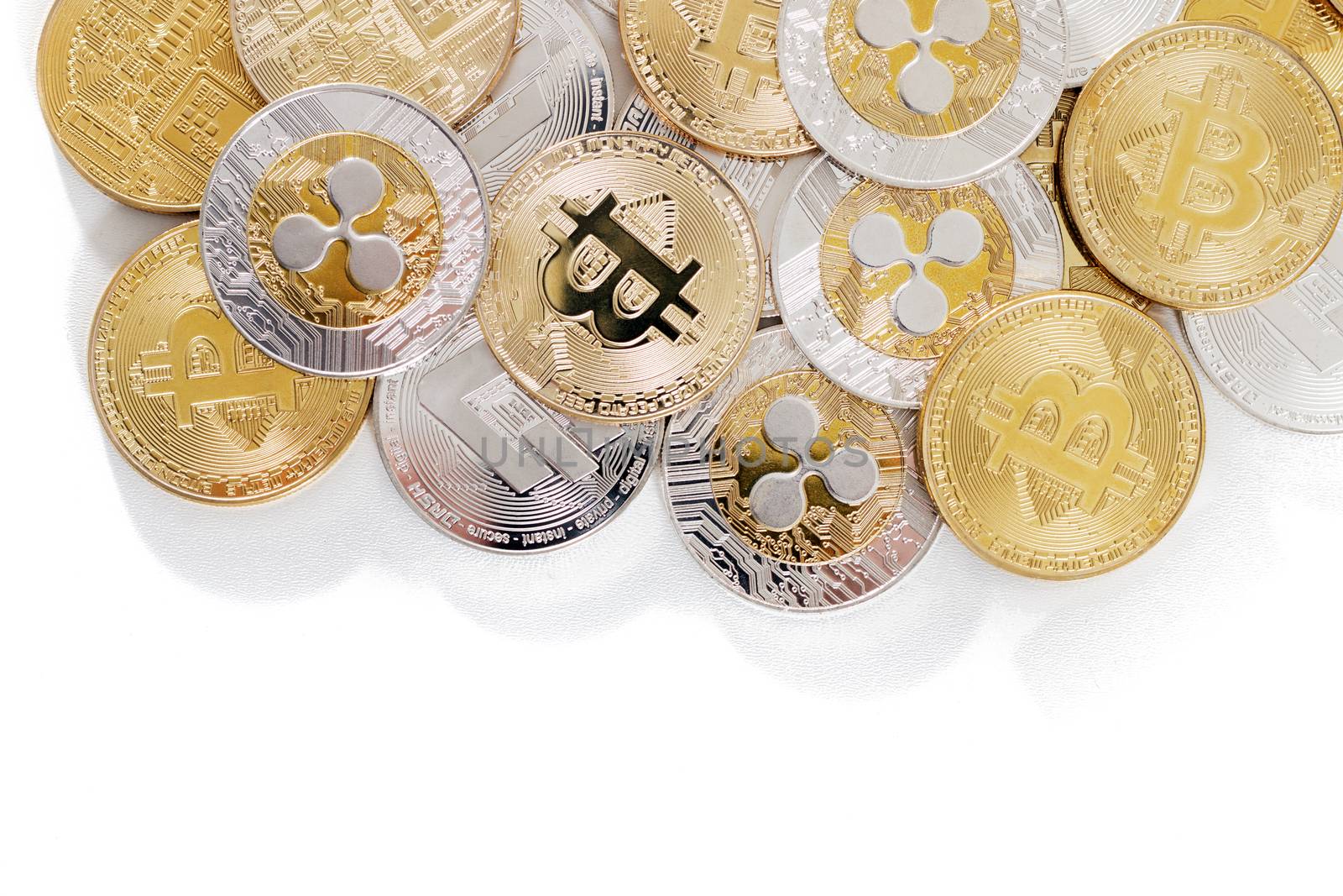 several aligned crypto currency coins on a white background.