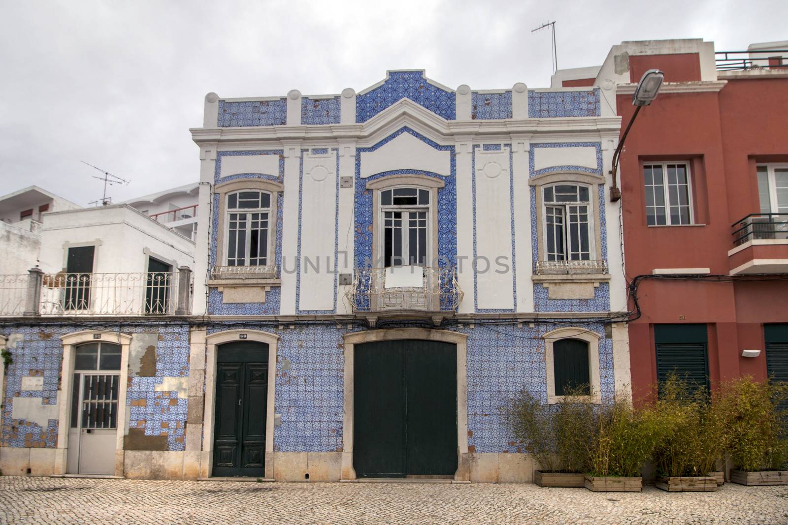portuguese building with blue azulejo tiles, typical of European mediterranean countries.