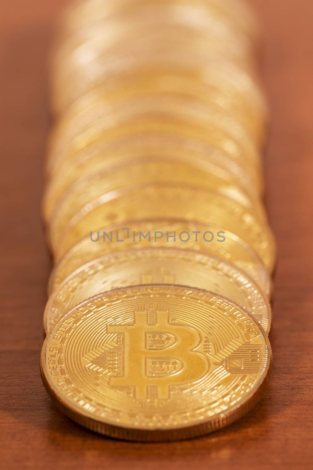 several golden bitcoins by membio