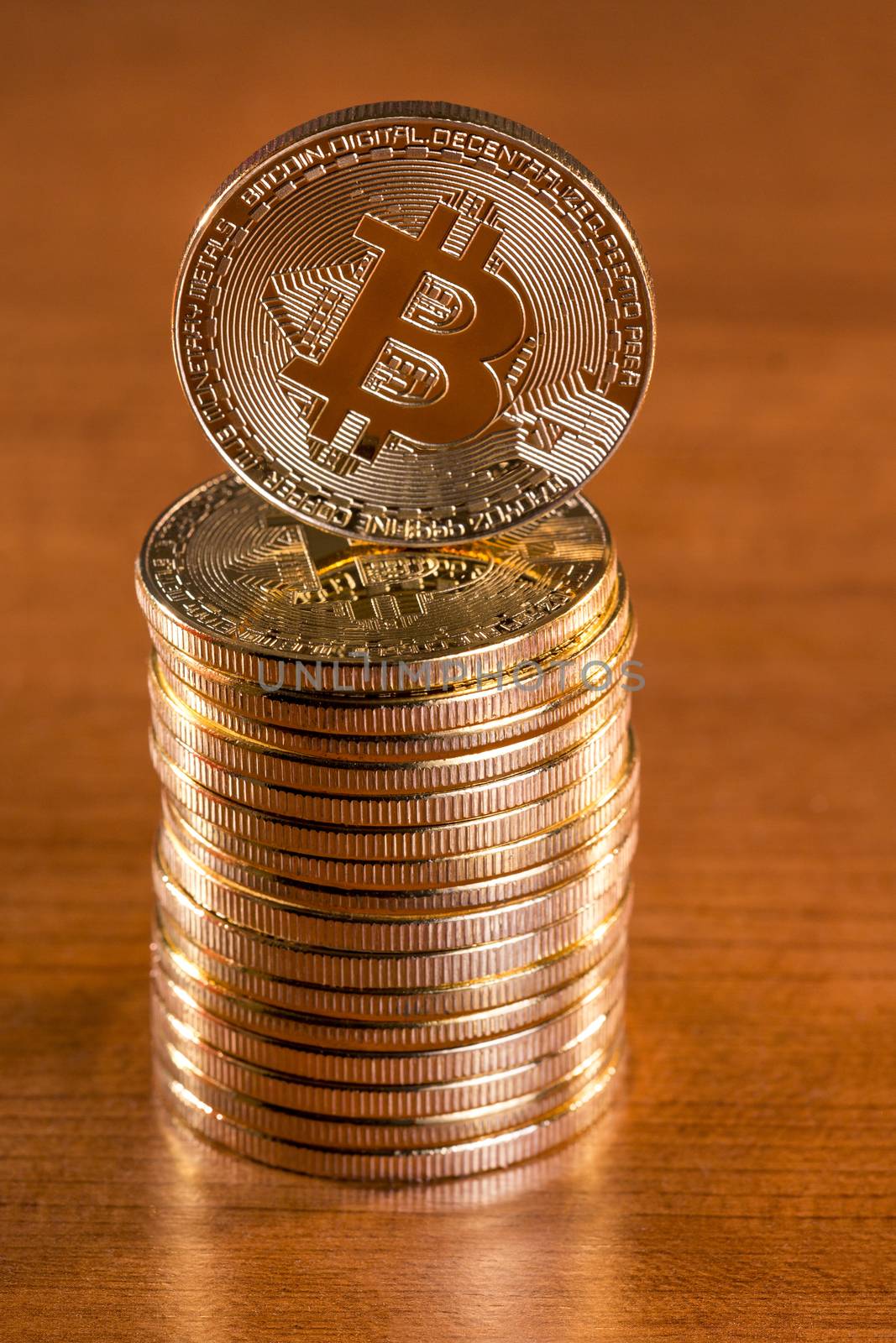 several golden bitcoins by membio