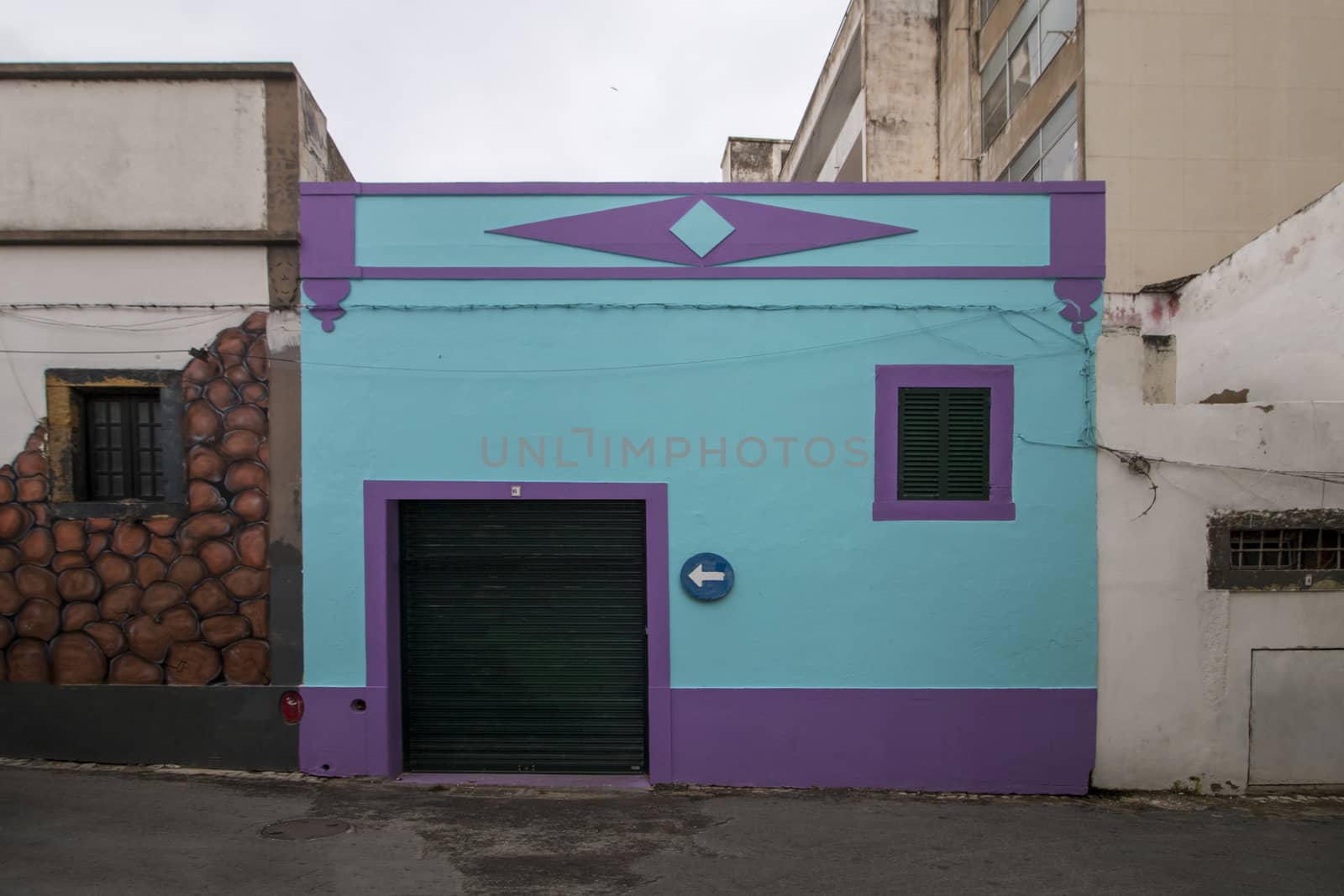 Small narrow portuguese building on the city of Faro, Portugal.