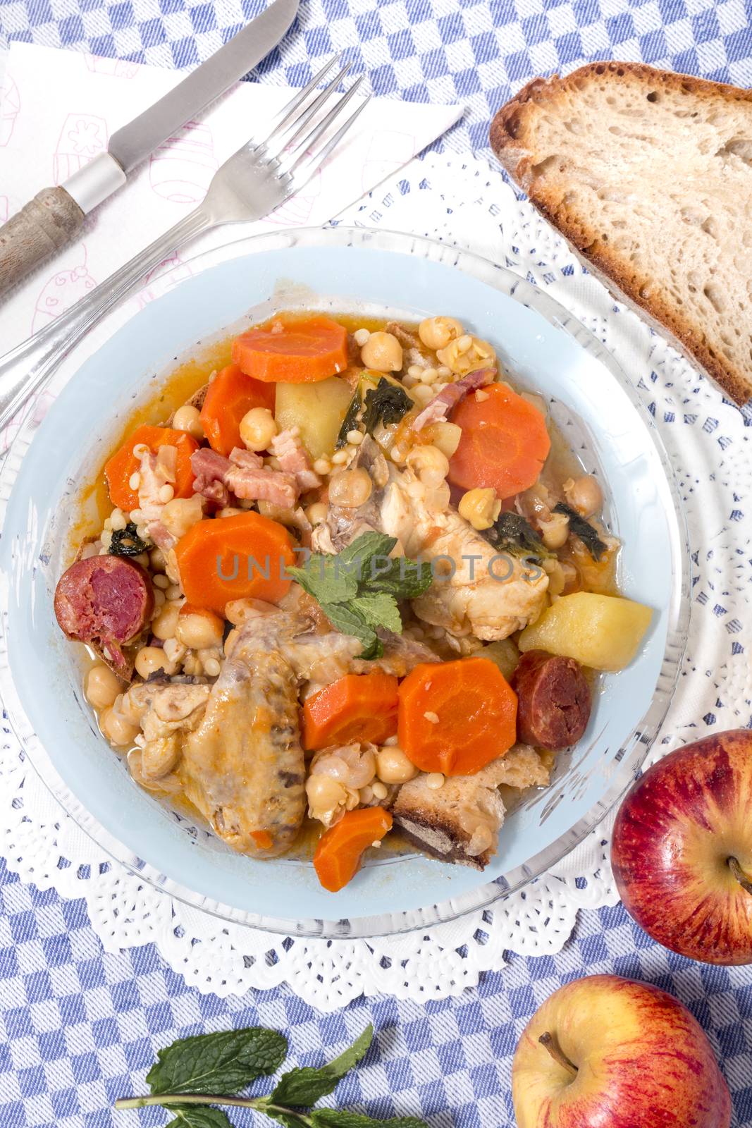 Traditional portuguese meal of Chickpeas with chicken, carrot and chorizo.