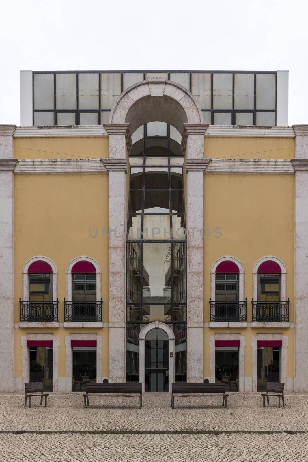 View of a tall and modern historical building in Faro city.