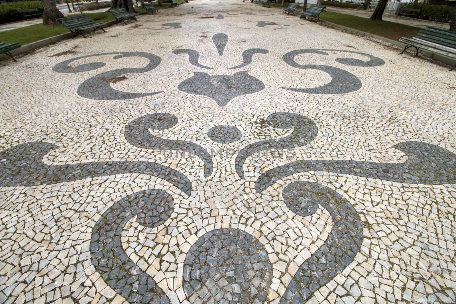 View of the Garden Manuel Bivar in Faro city with cobblestone art.