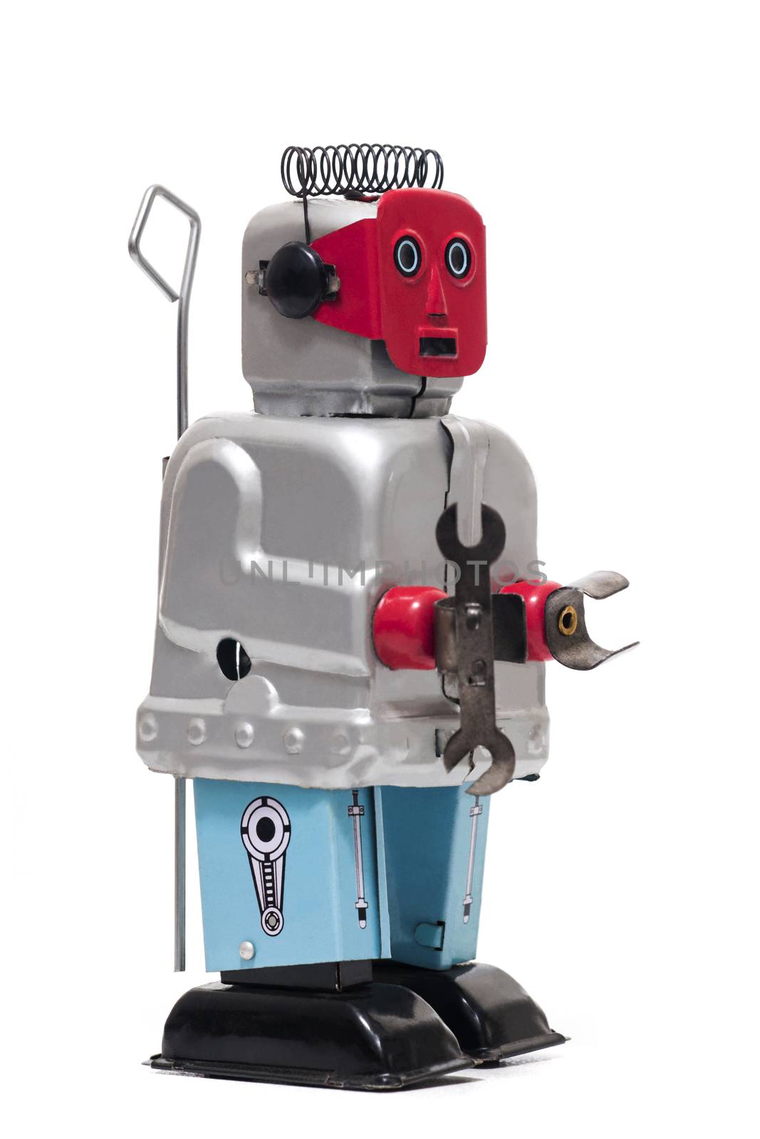 Vintage retro red face tin toy robot isolated on a white background.