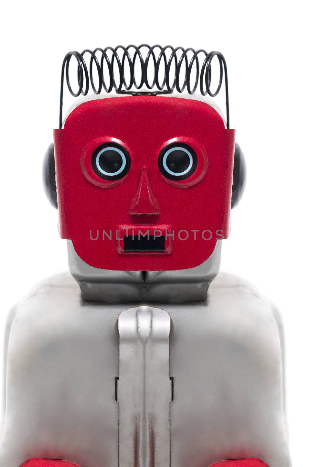 Vintage retro red face tin toy robot isolated on a white background.