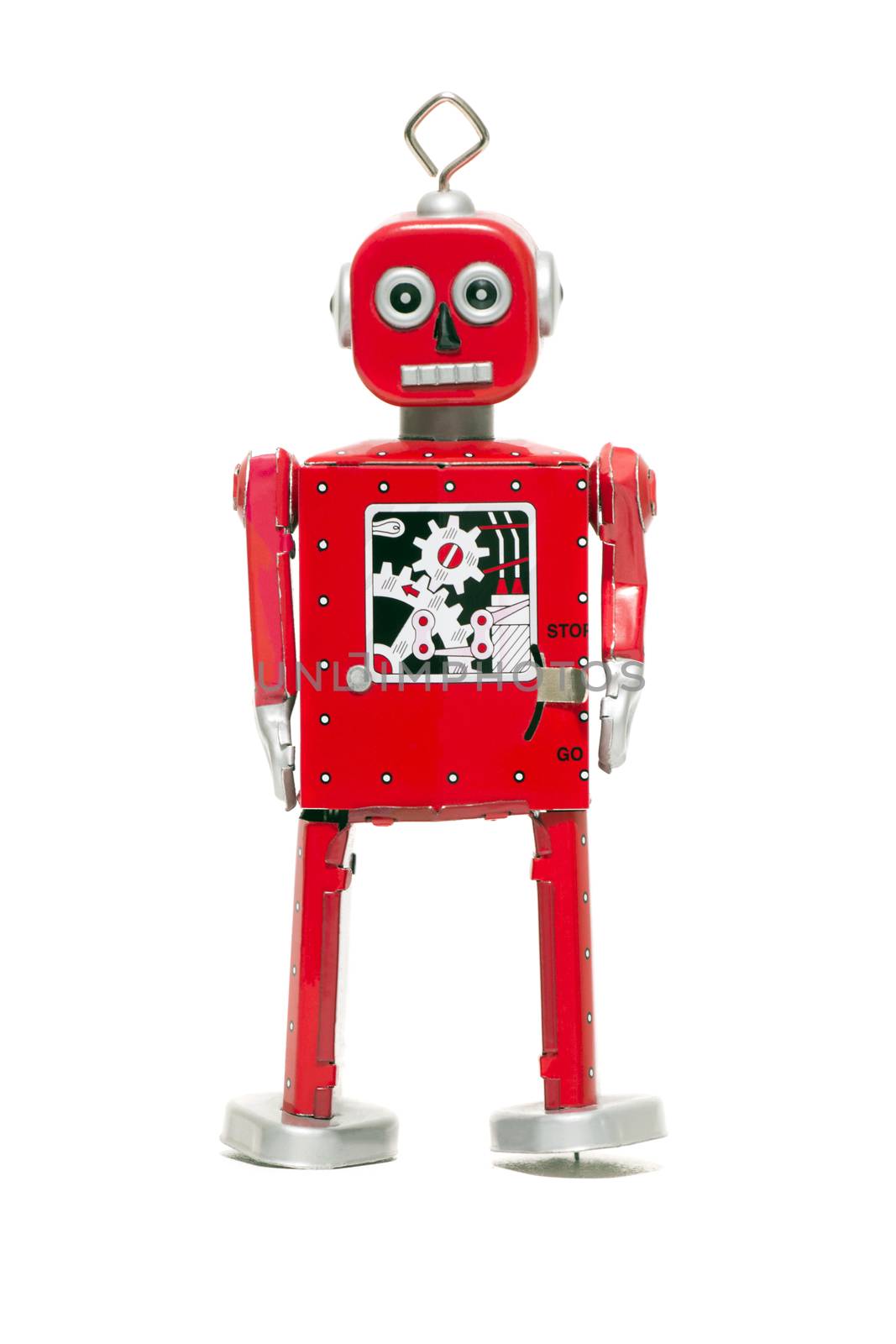 Vintage retro red tin toy robot isolated on a white background.