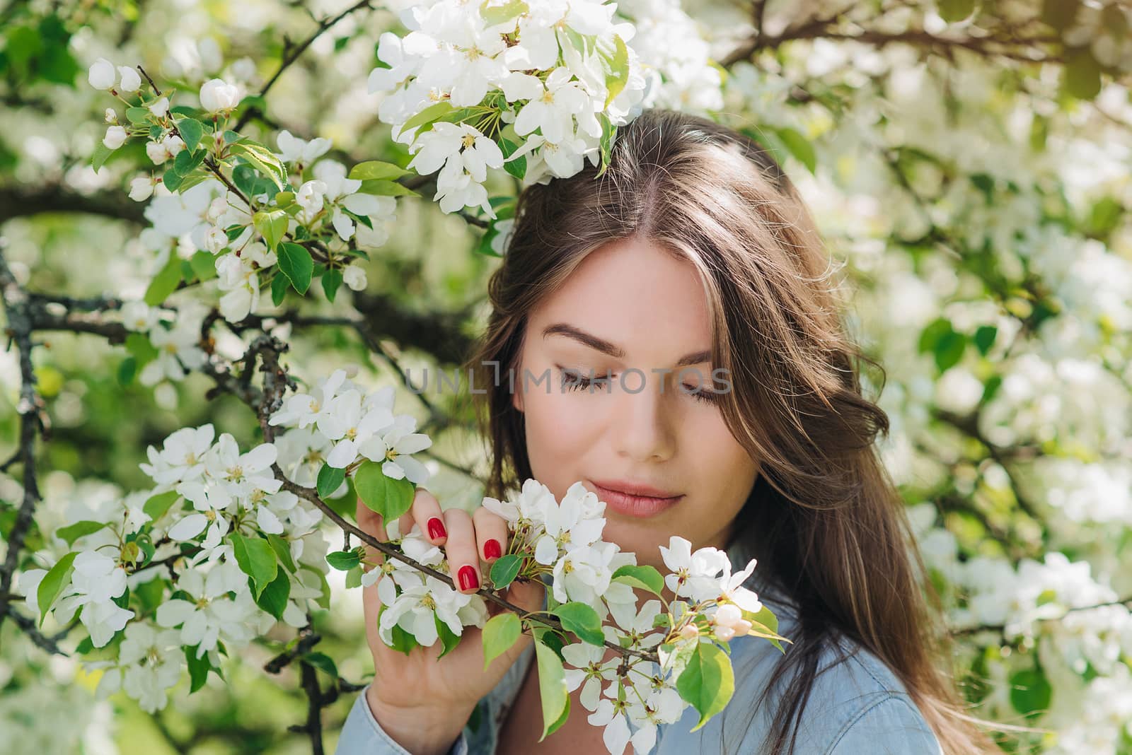 Woman near blooming apple tree by ALotOfPeople