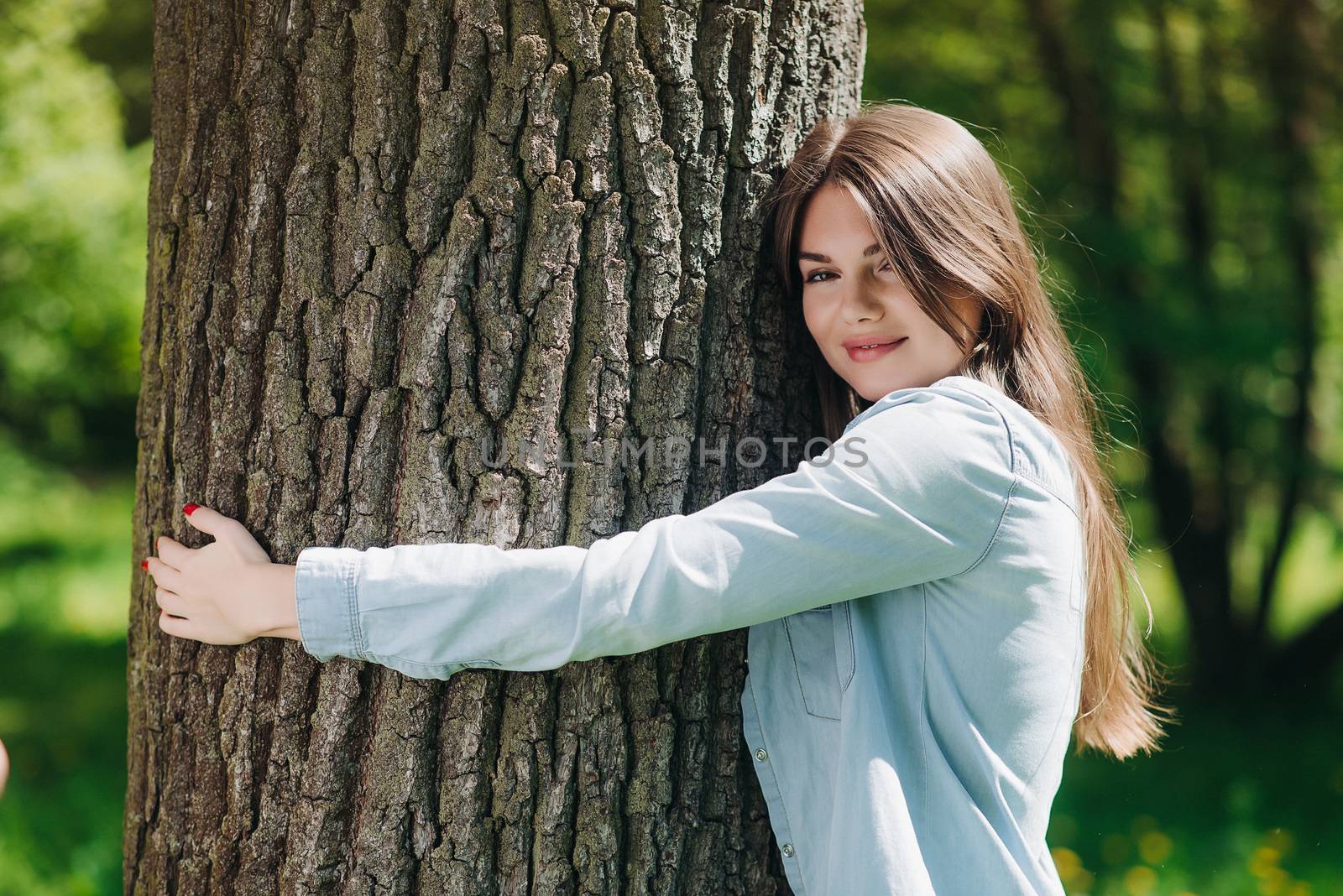 Woman hugging a big tree by ALotOfPeople