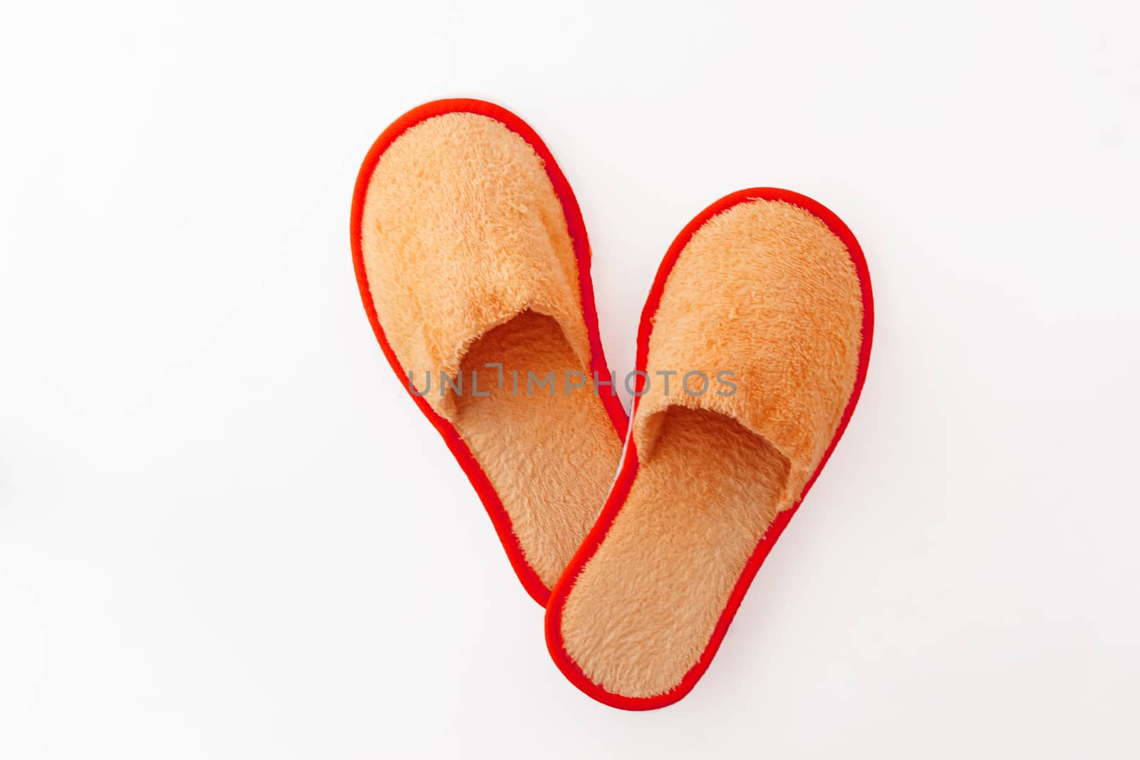 multicolored soft fluffy house slippers isolated on white background.
