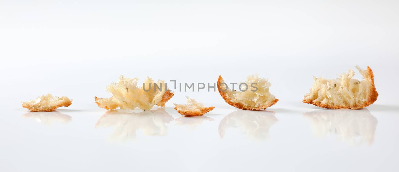 small pieces of fresh ciabatta bread on white background
