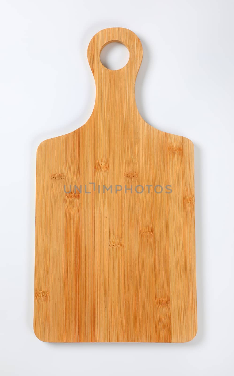 wooden cutting board with handle on white background