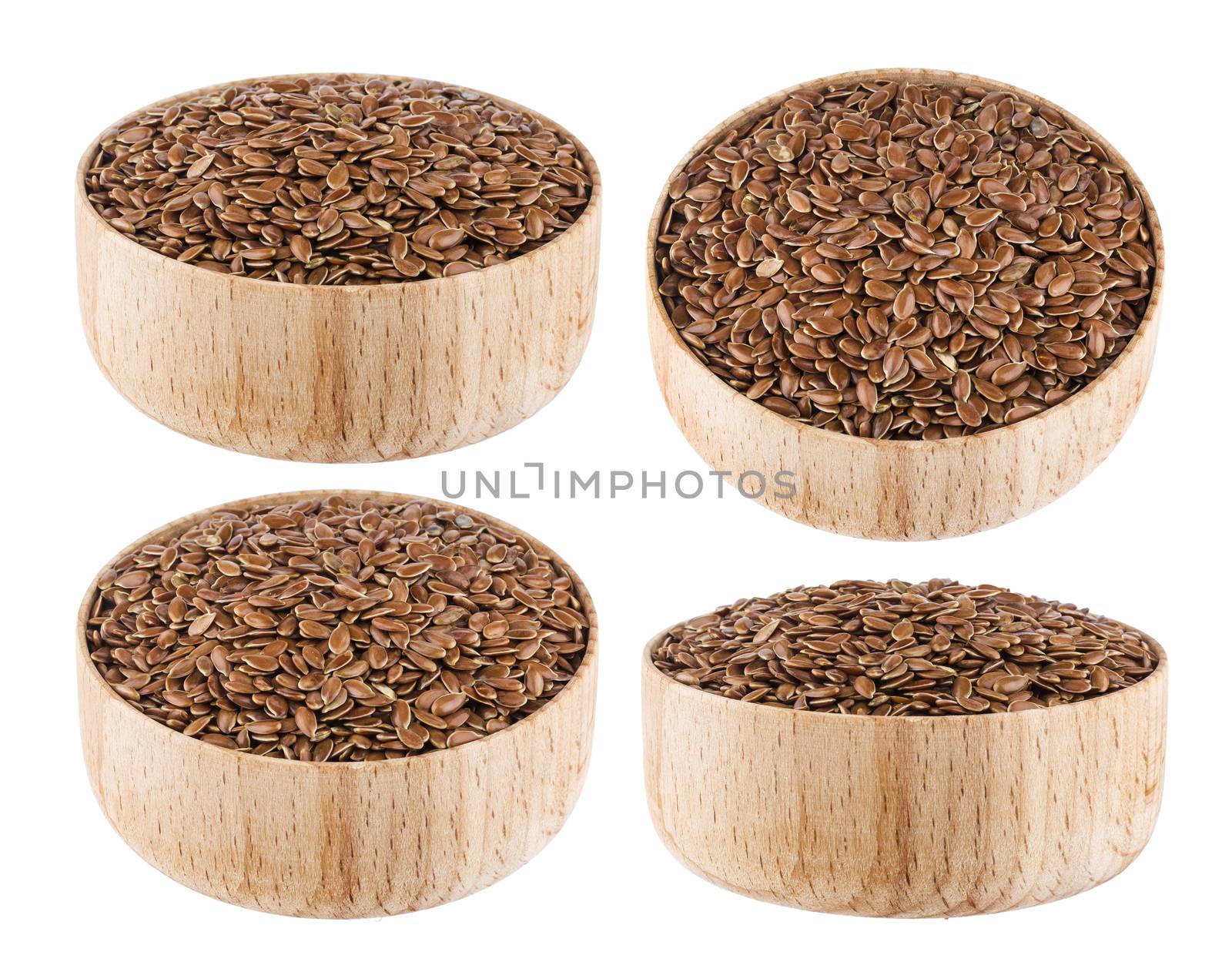 Flax seeds in wooden bowl isolated on white background close up
