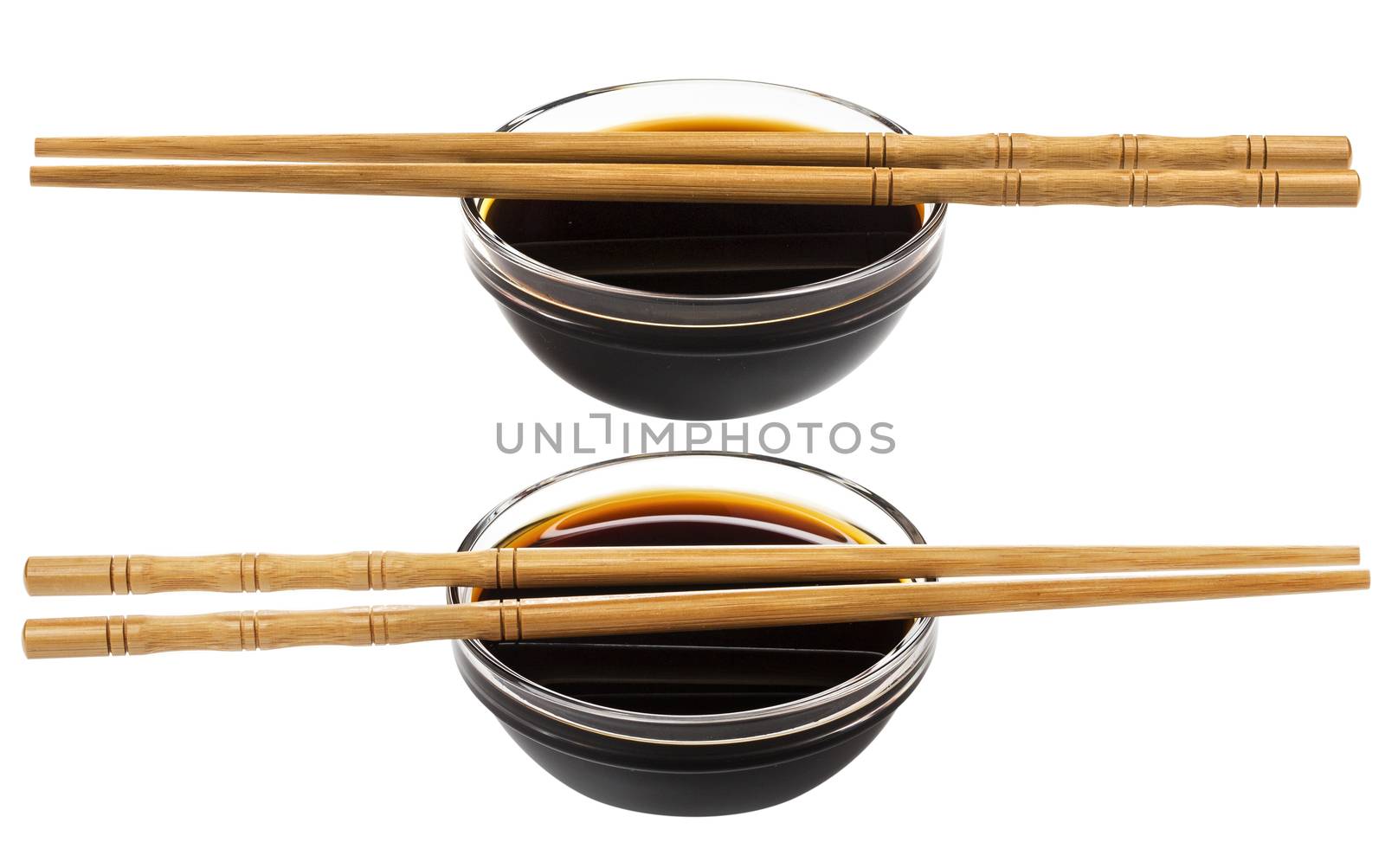 Glass bowl of soy sauce isolated on white background with clipping path