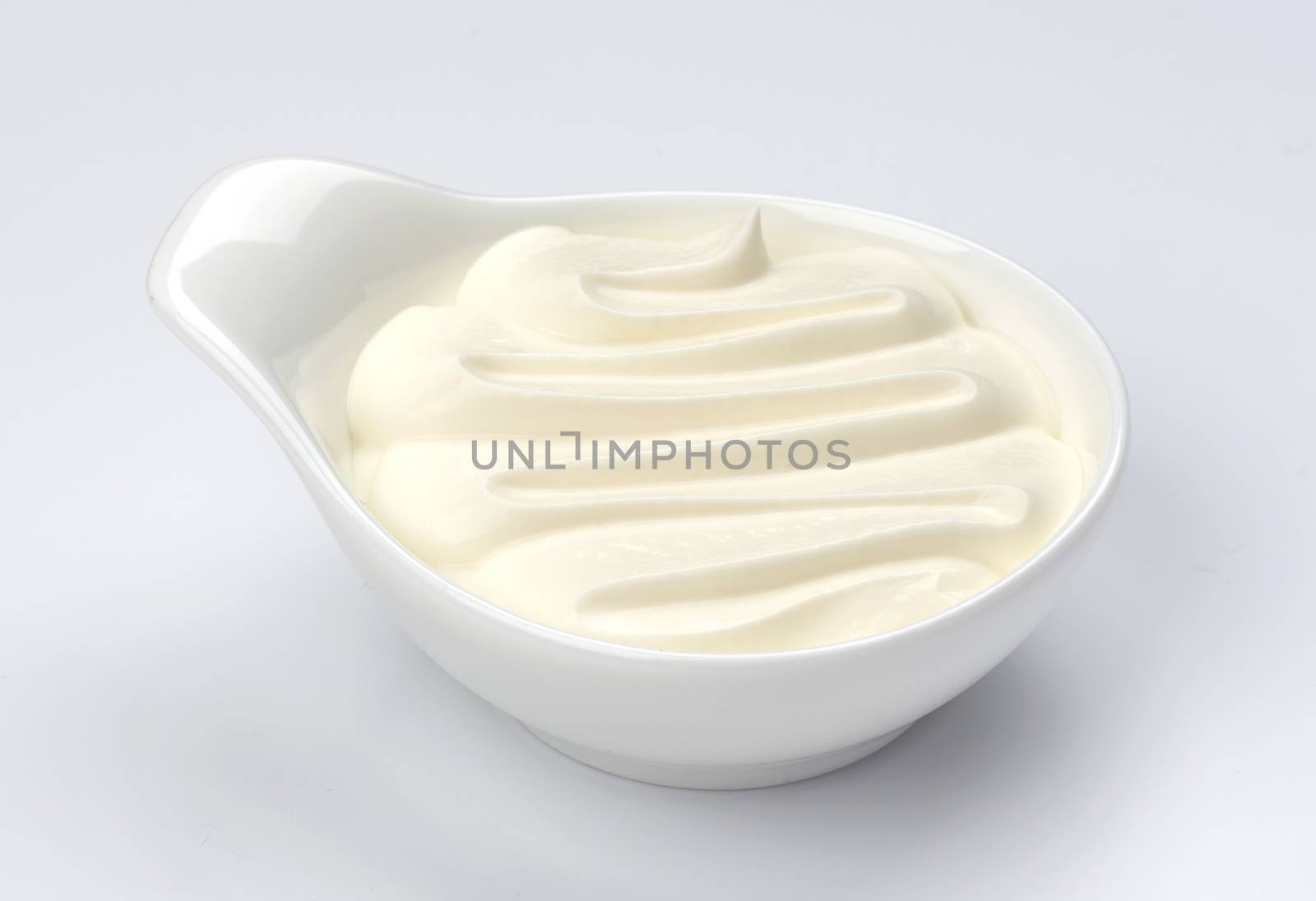 Greek yogurt in bowl on white background, cream isolated by xamtiw