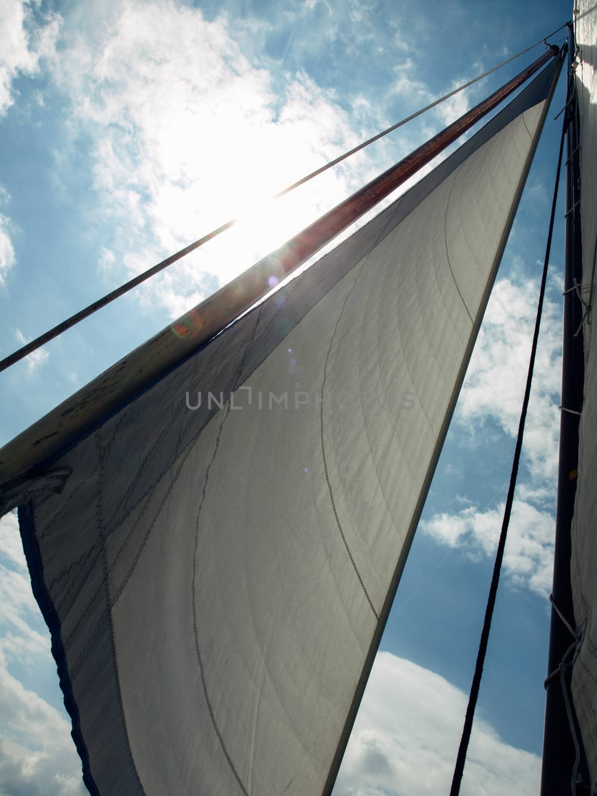 White sail against blue sky by kimbo-bo