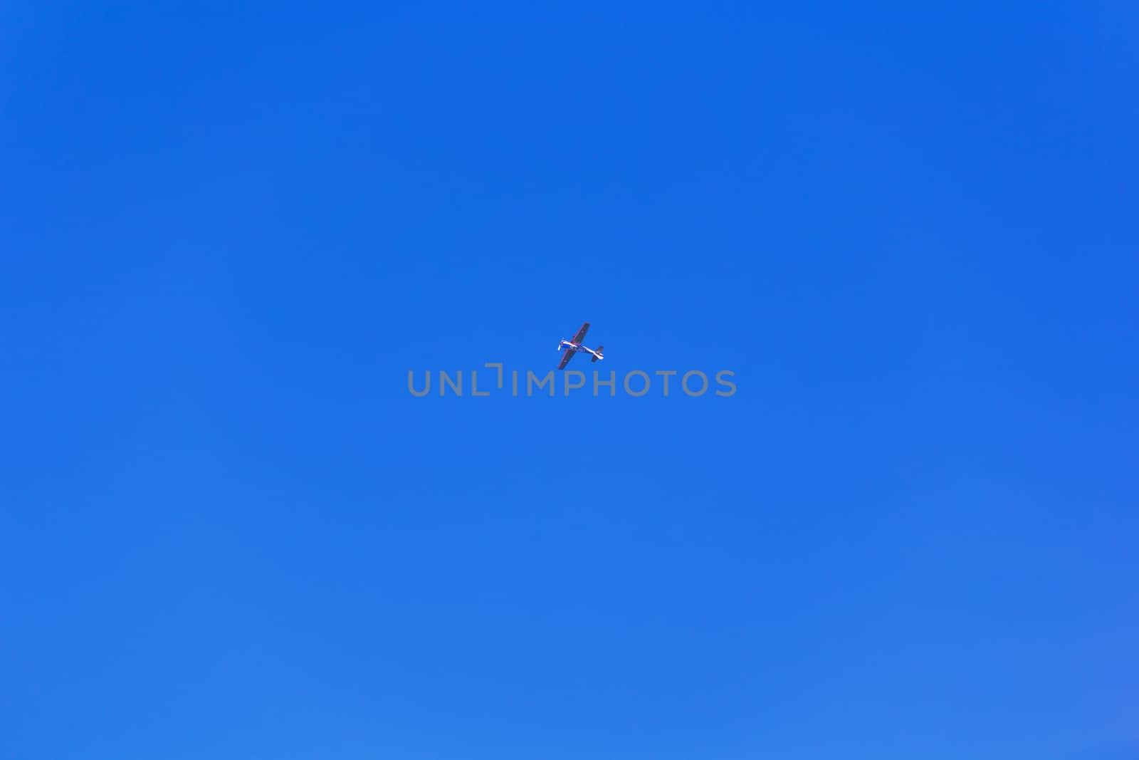 Military airplane in blue sky by Julialine