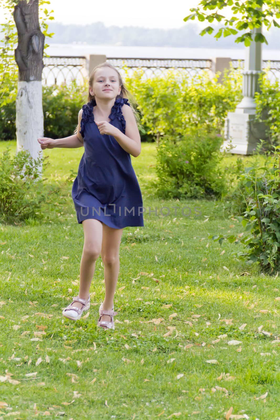 Vertical photo of cute running European girl with disheveled hair