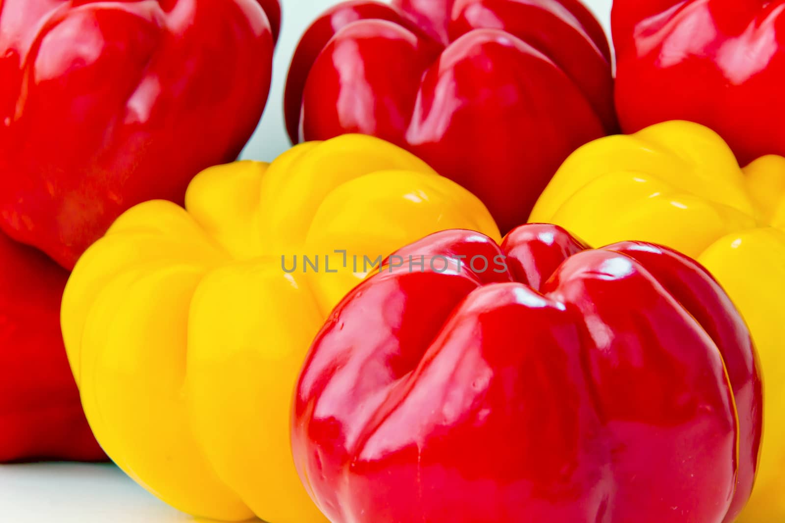 Background of big fresh red and yellow raw pepper