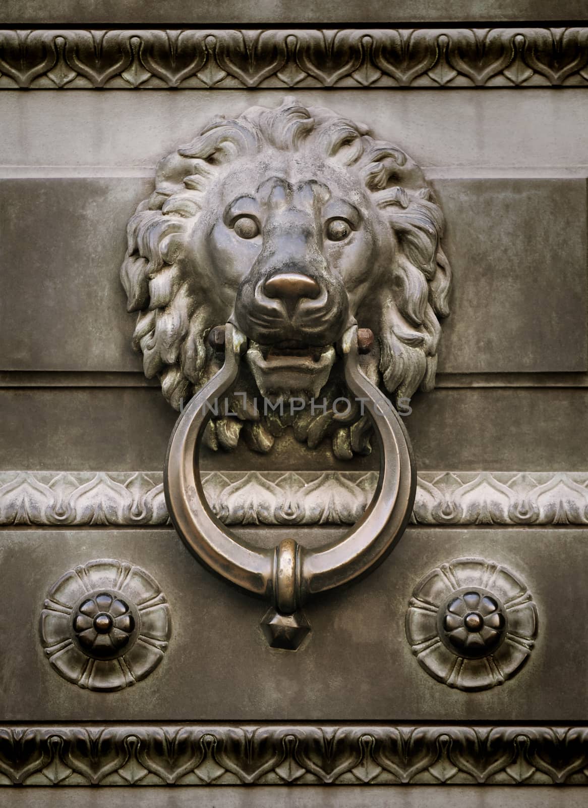 Old lion head door knocker sepia toned