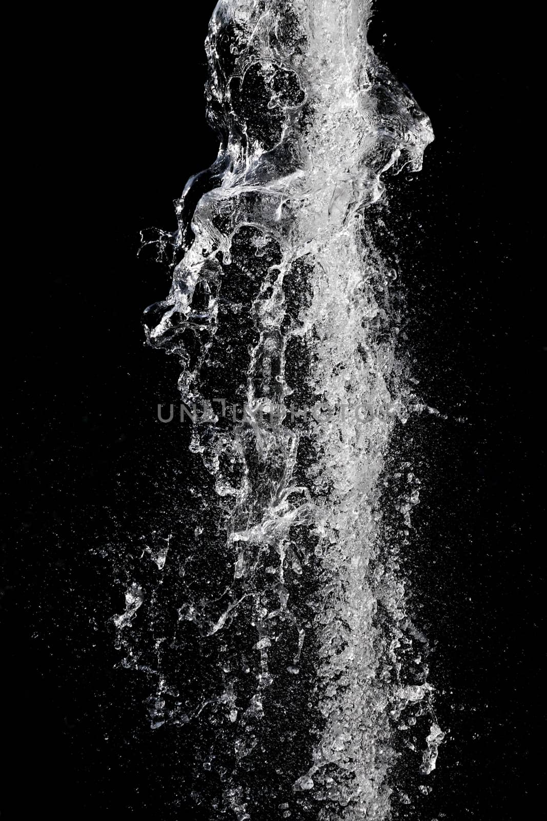 Splash of pouring water isolated over black background