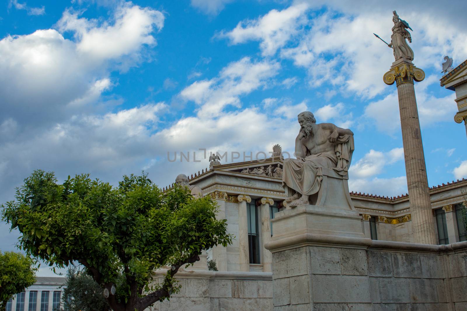 classical statue of Socrates from side with athena statue above