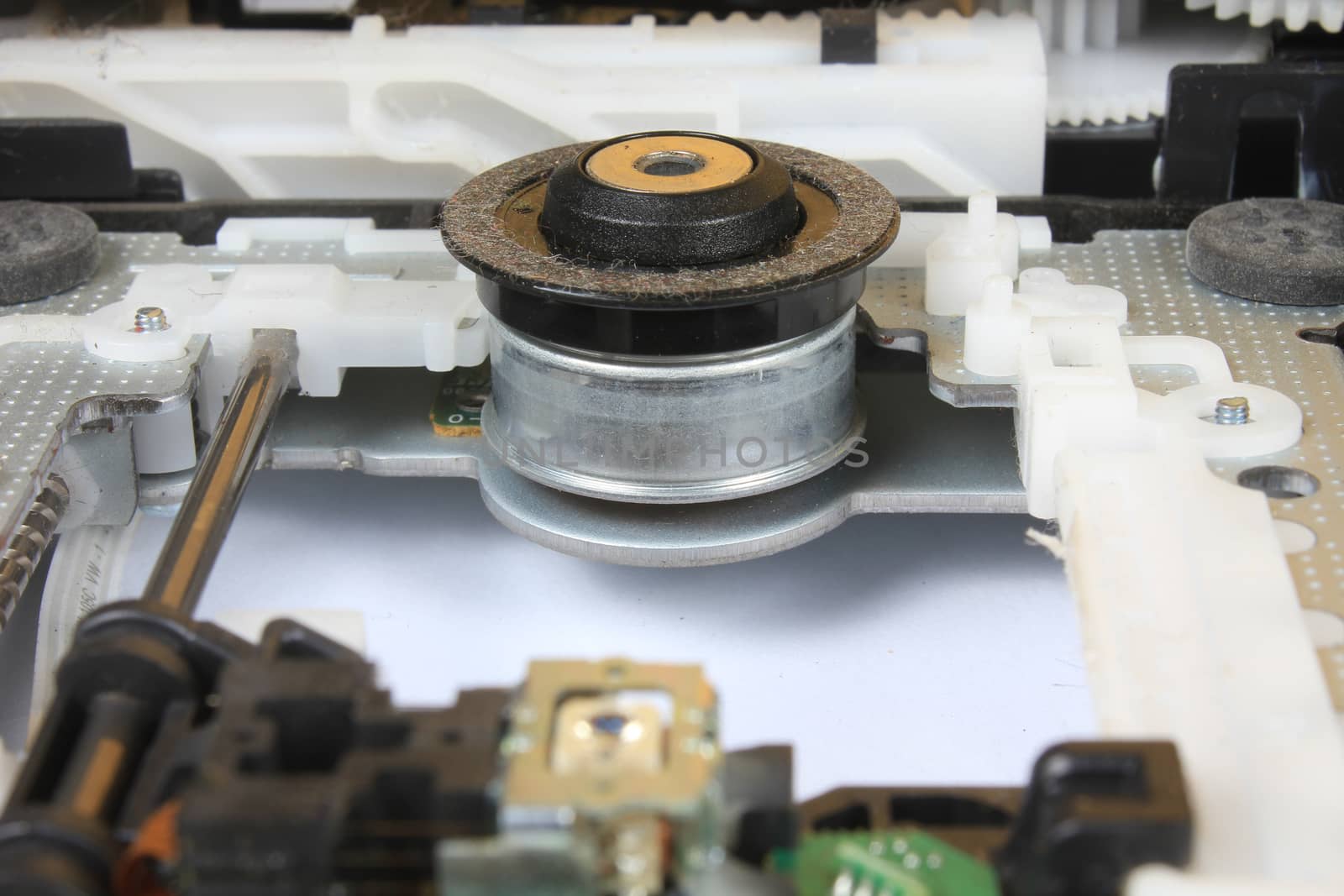 A detailed view of the motor and other parts inside an open DVD Drive of a computer