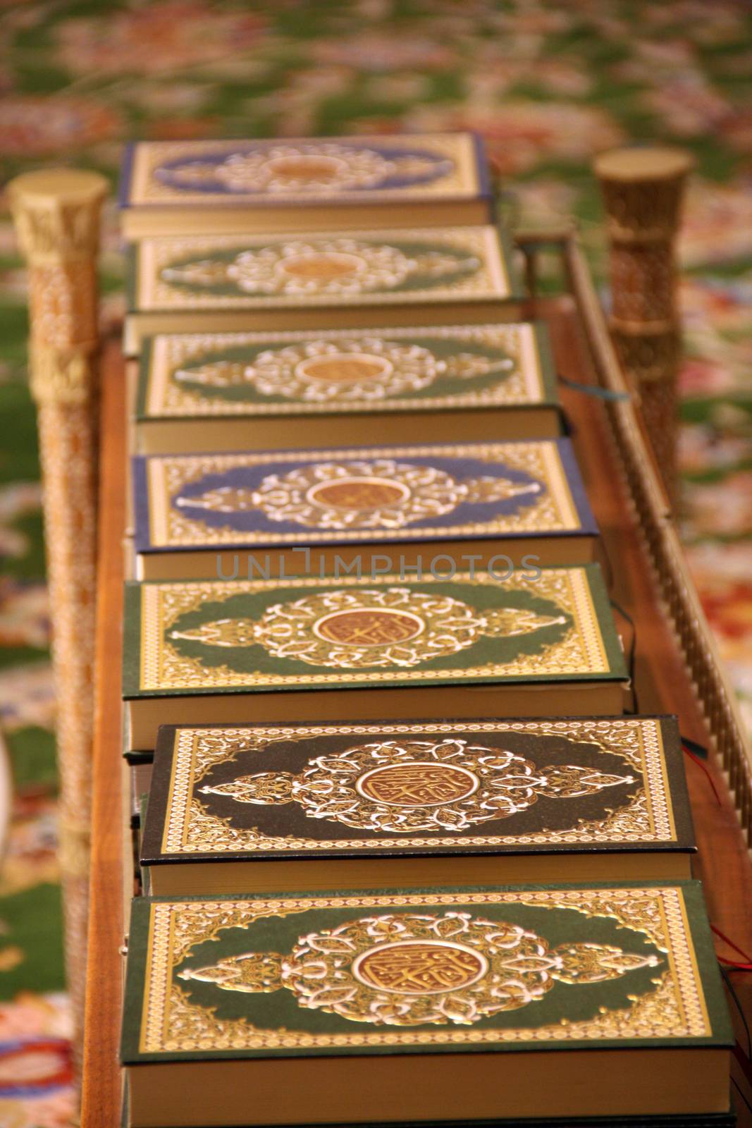 A line of holy Qurans in different cover designs at the grand mosque 