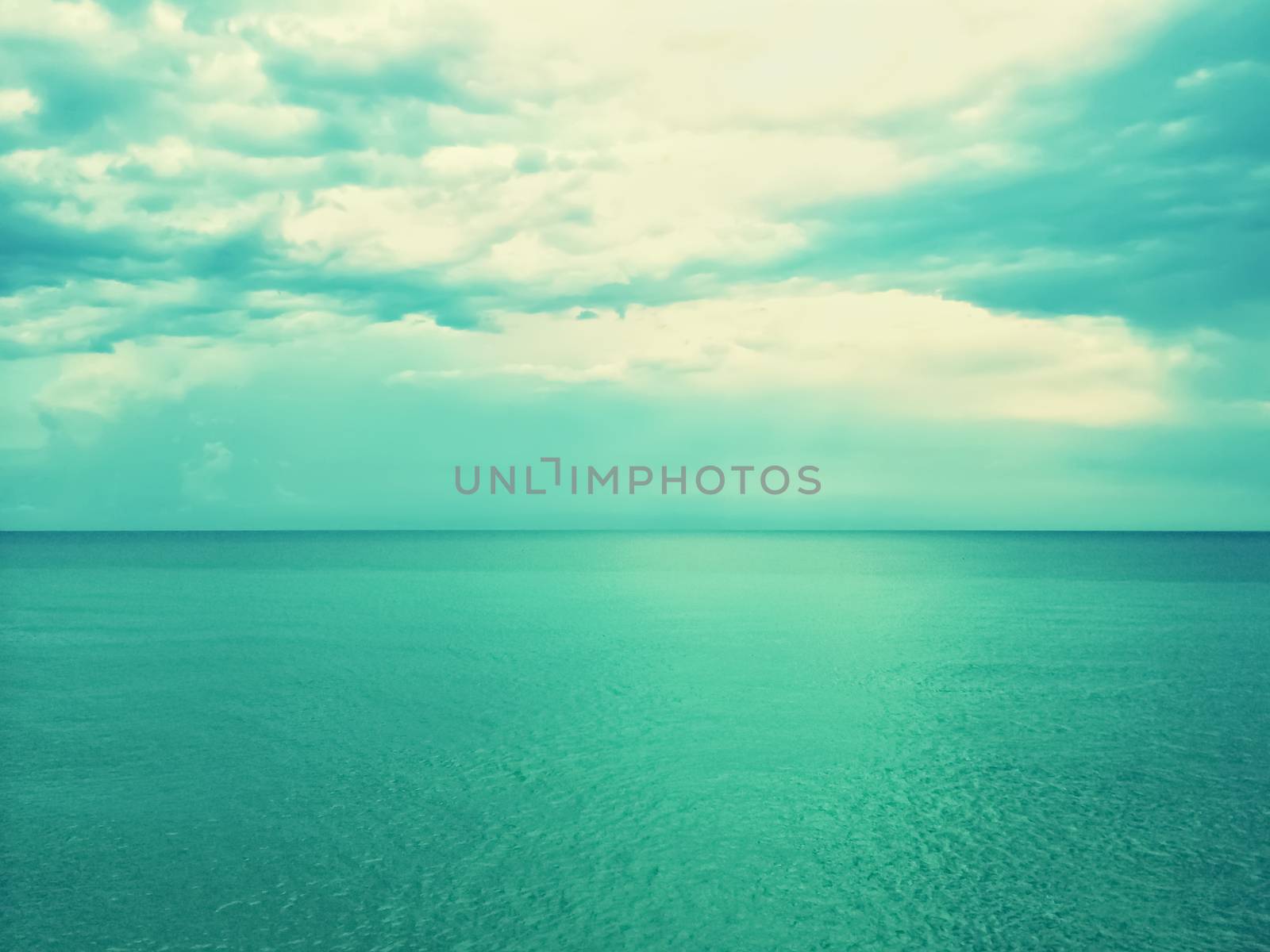 Retro image of sea and sky in green shades by anikasalsera