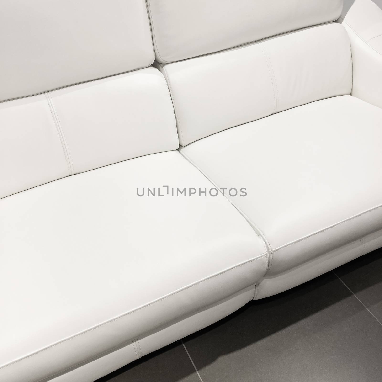 Beautiful classy white sofa. Luxurious leather furniture.