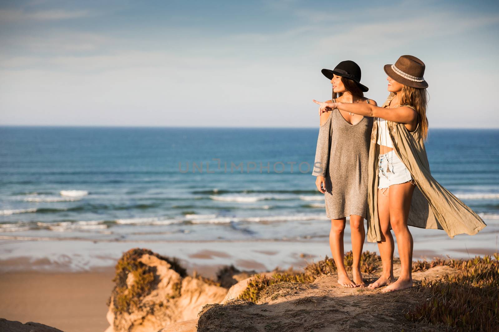 Beautiful girls looking the beach by Iko