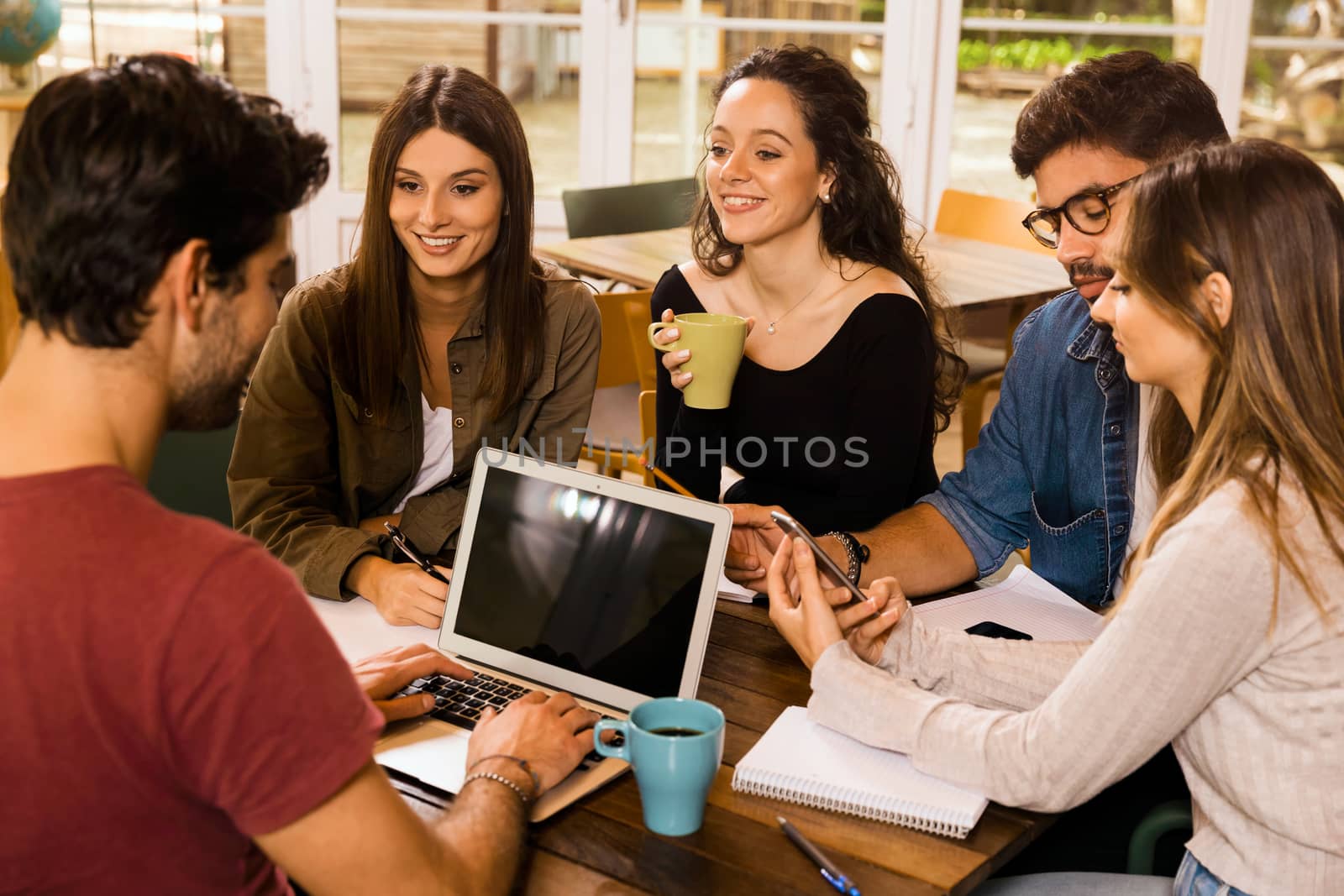 Group of friends studying together for finals