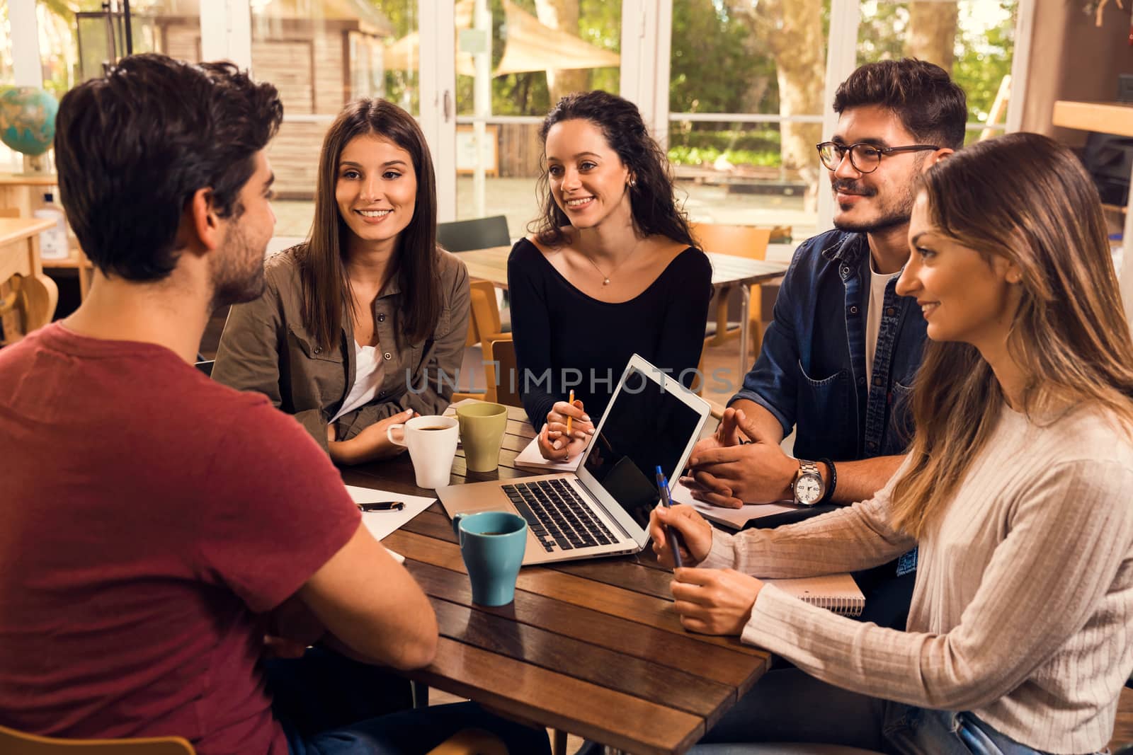 Group of friends studying together for finals