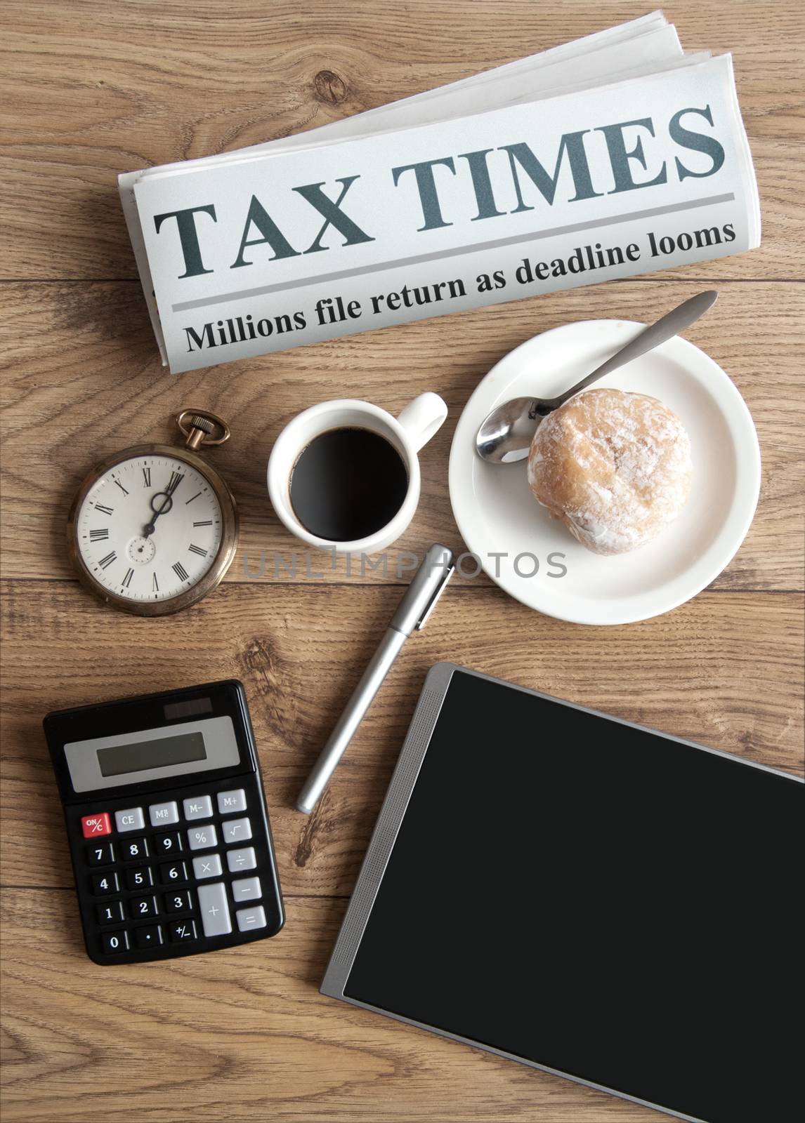 Tax times mock up newspaper with clock, calculator and tablet