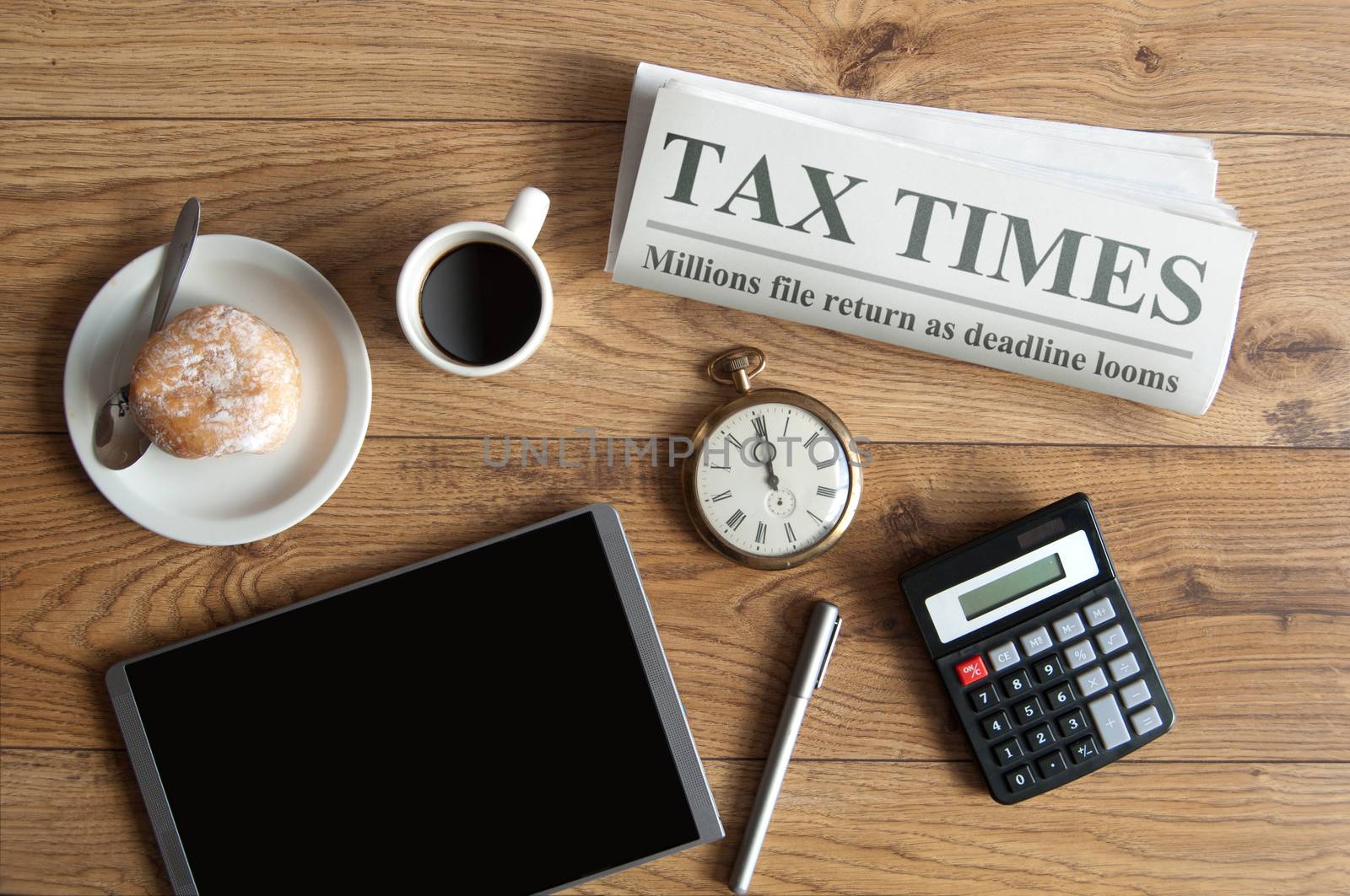 Tax time concept, mock up newspaper headline by unikpix