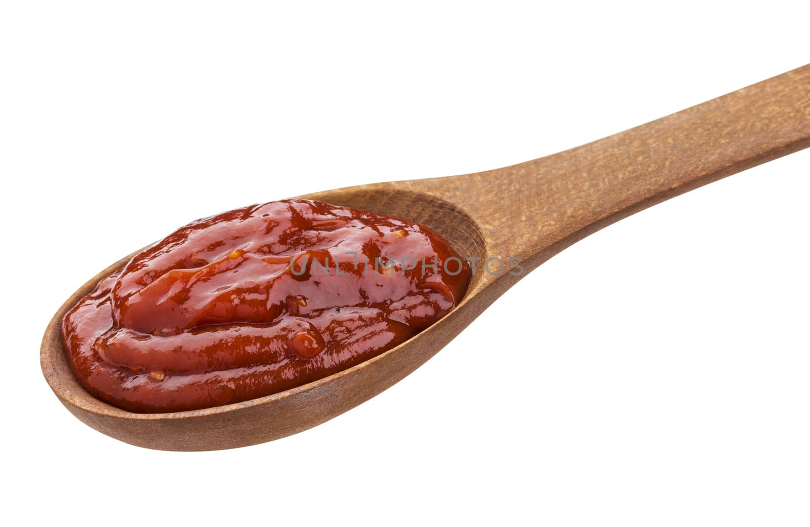 Ketchup in wooden spoon. Tomato paste isolated on white background with clipping path