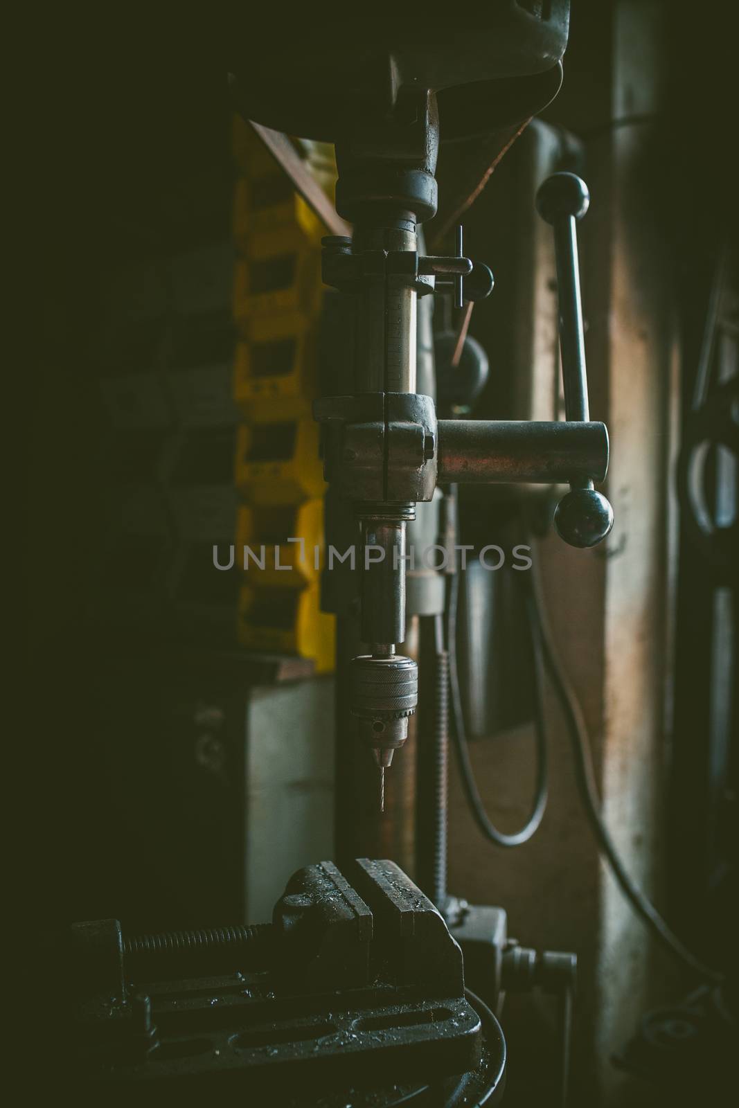 vintage metal drill machine in workshop