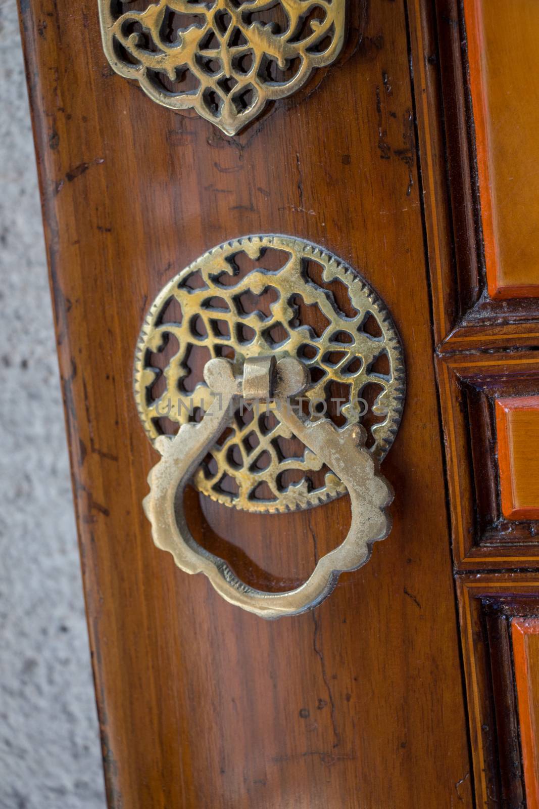 Old Handmade ottoman door knob on wood