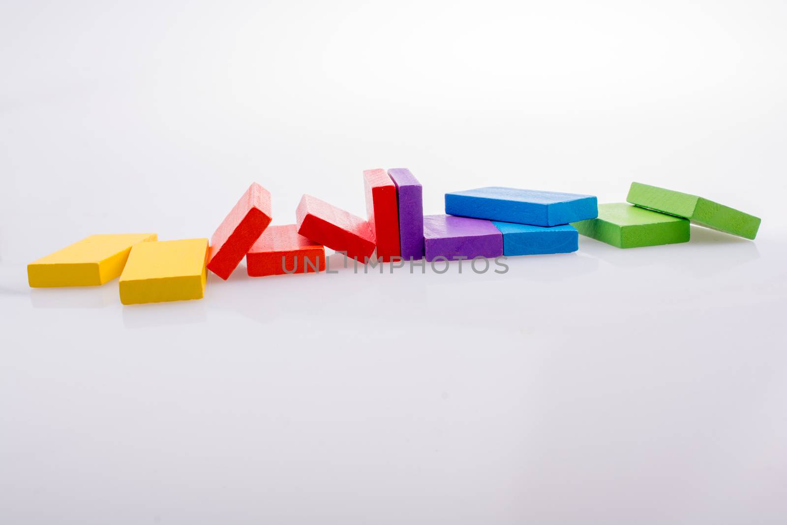 Colorful Domino Blocks in a line on a white background