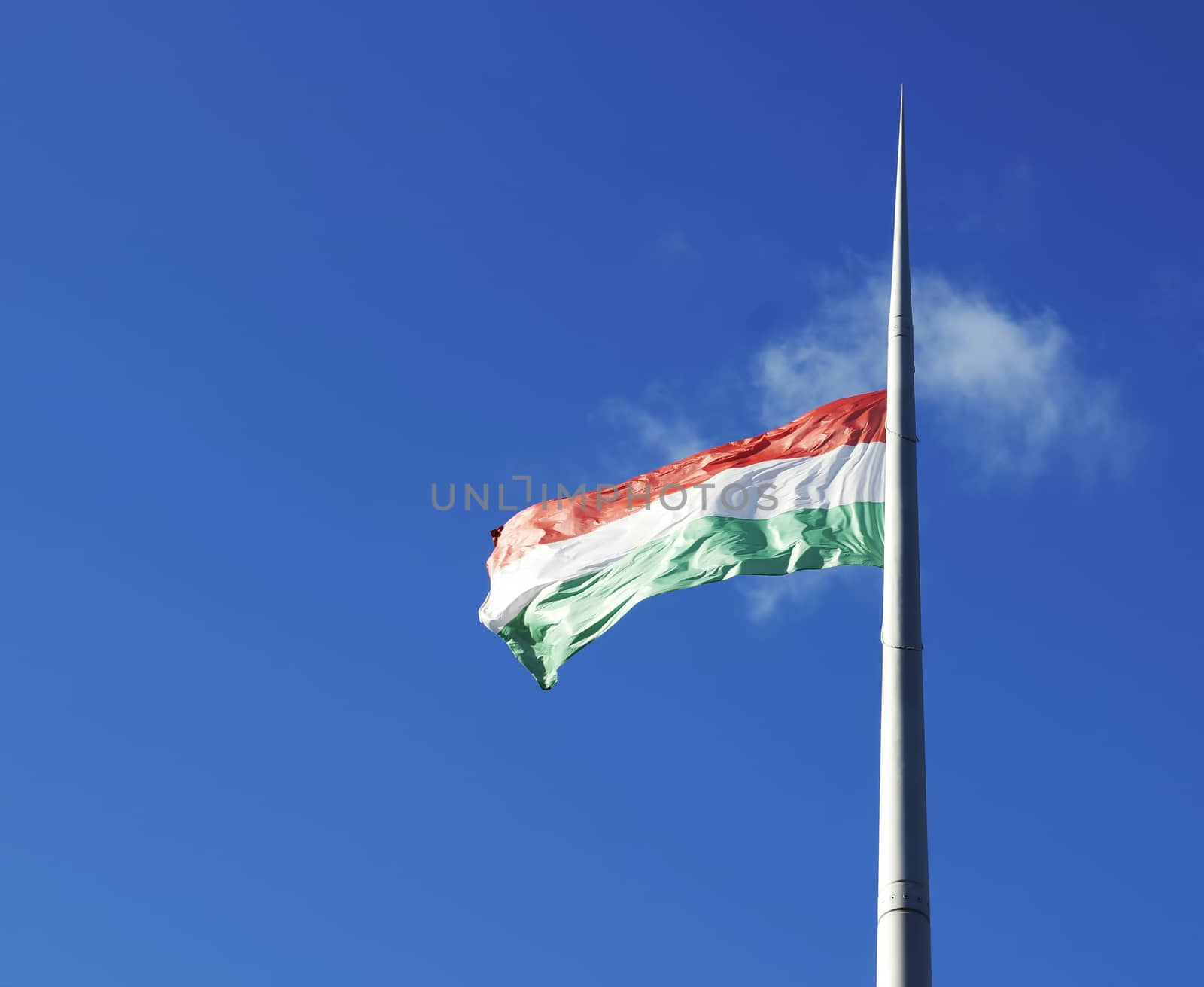 Hungarian flag against blue sky 