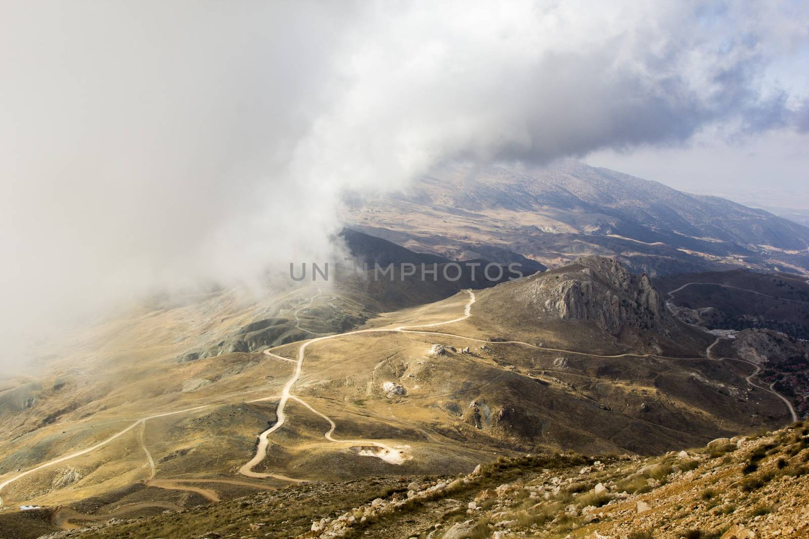 the serpentine road through sunlit mountains. Antalya