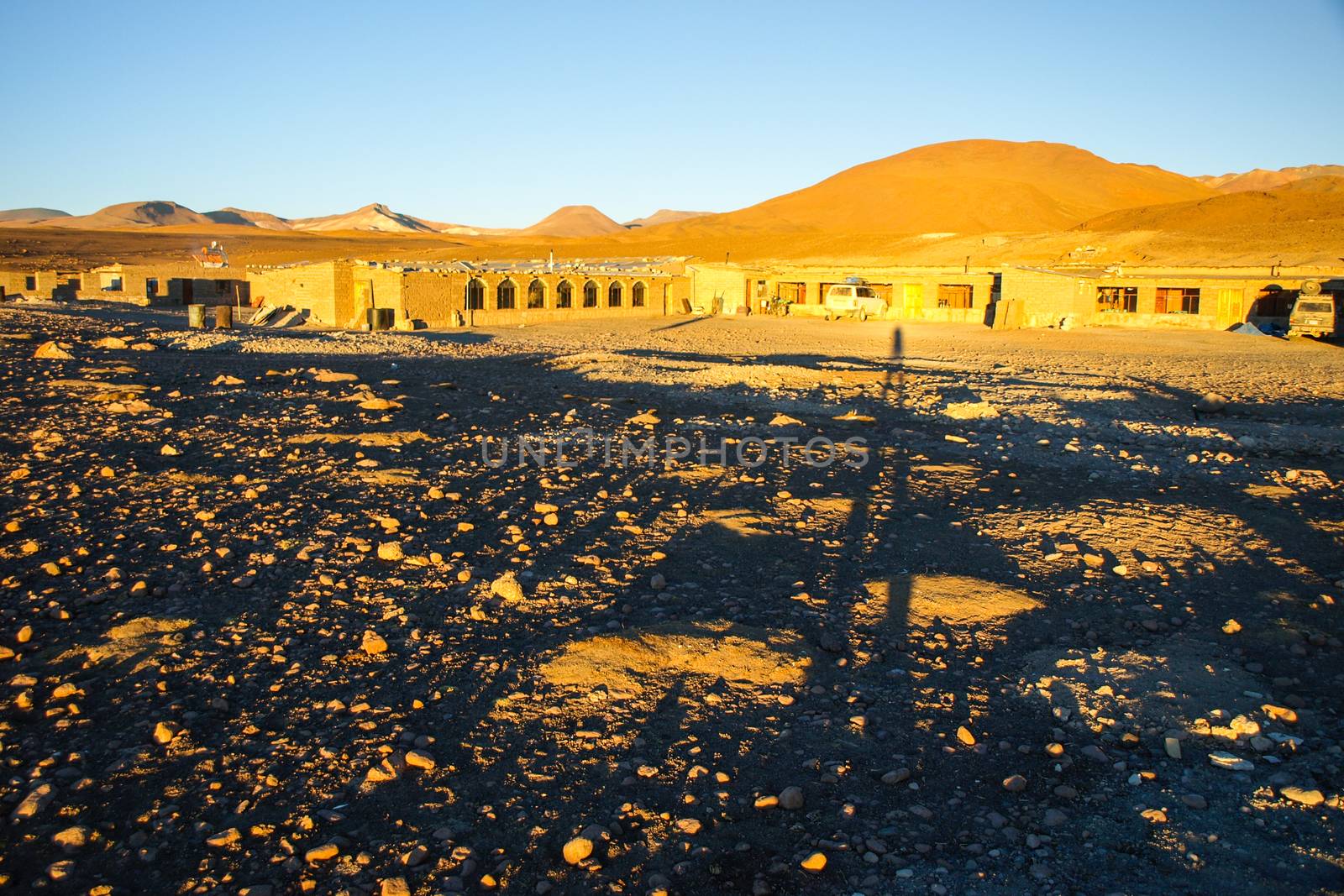 Evening landscape and accomodation buldings at Laguna Colorada, Altiplano area, Bolivia, South America.