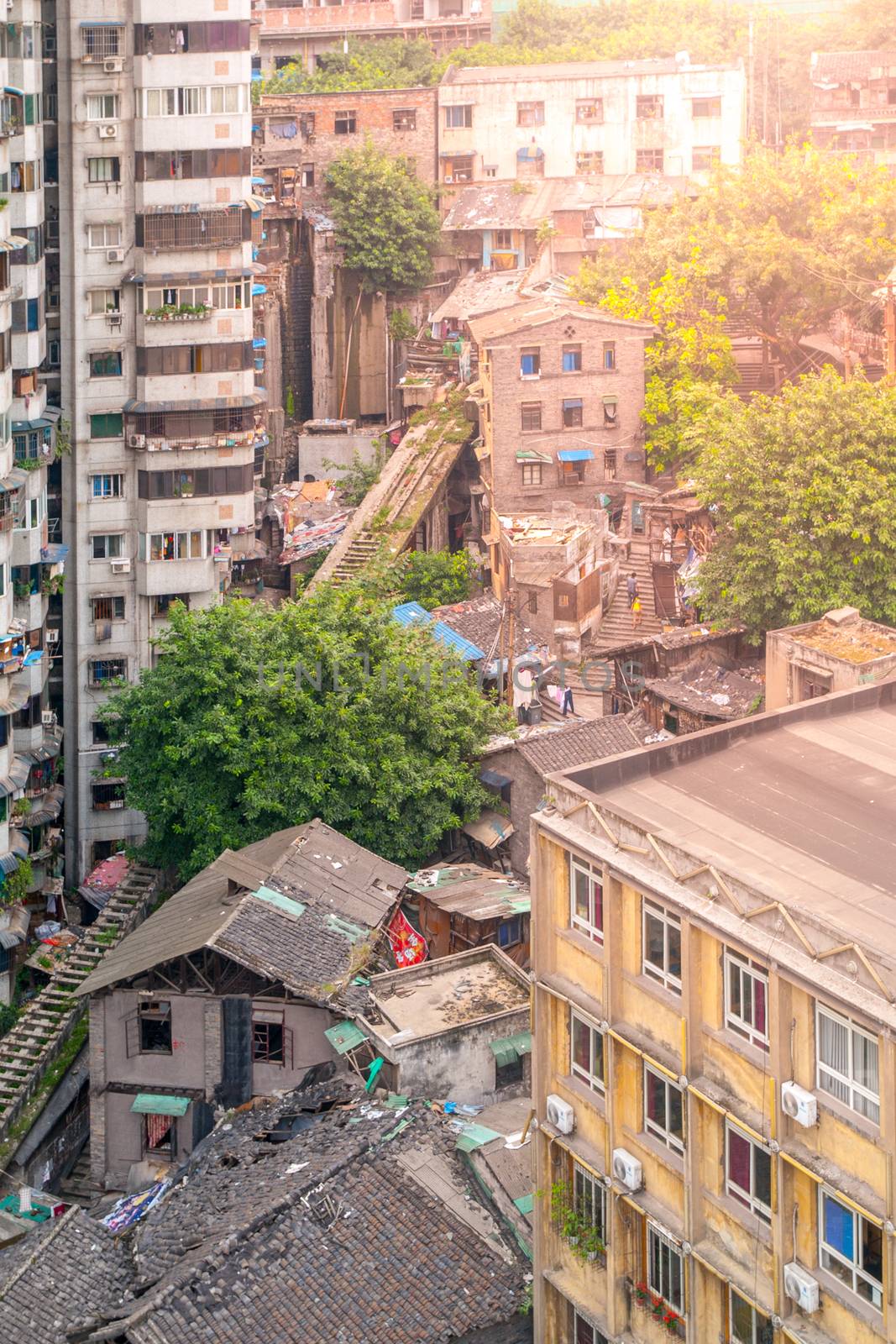 Aerial view of dirty city slum with old unfunctional ground cable car way in Chongqing, China by pyty