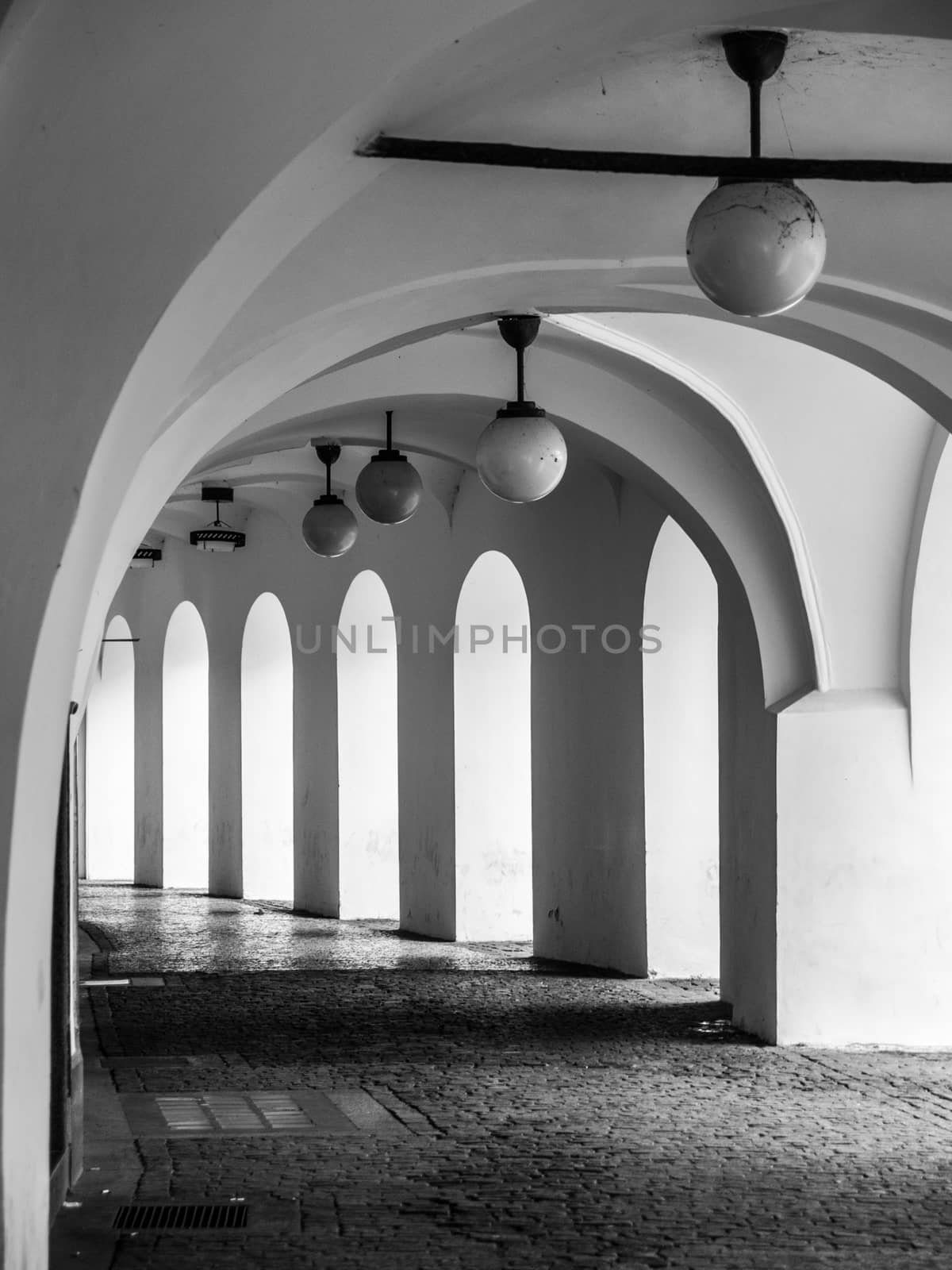 Old historical arcade at Little Square in Old Town, Prague, Czech Republic. Black and white image.