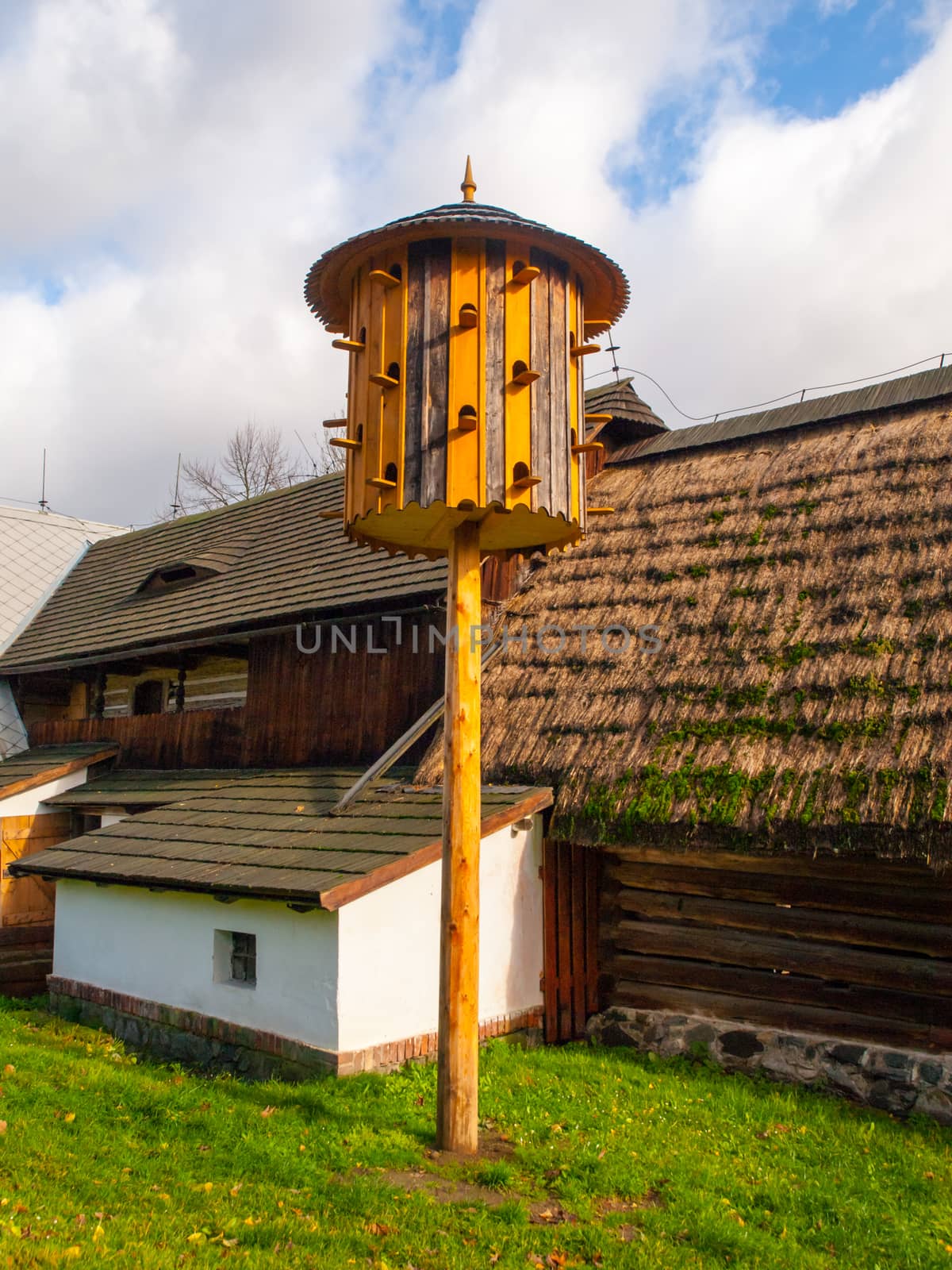 Vintage wooden dovecote in rural open-air museum by pyty
