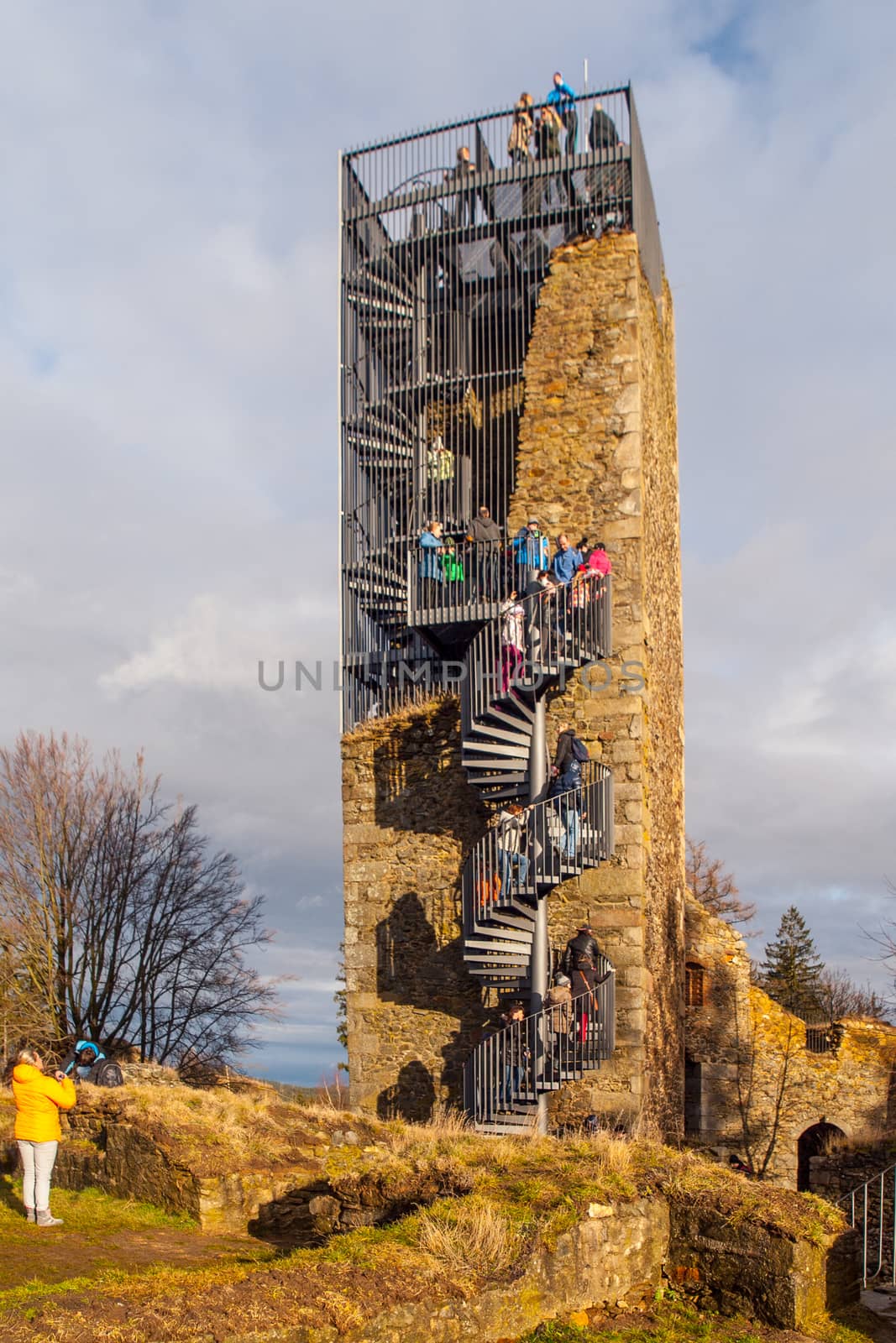 Orlik nad Humpolcem castle tower after reconstruction with many tourists on the top, Vysocina, Czech Republic.